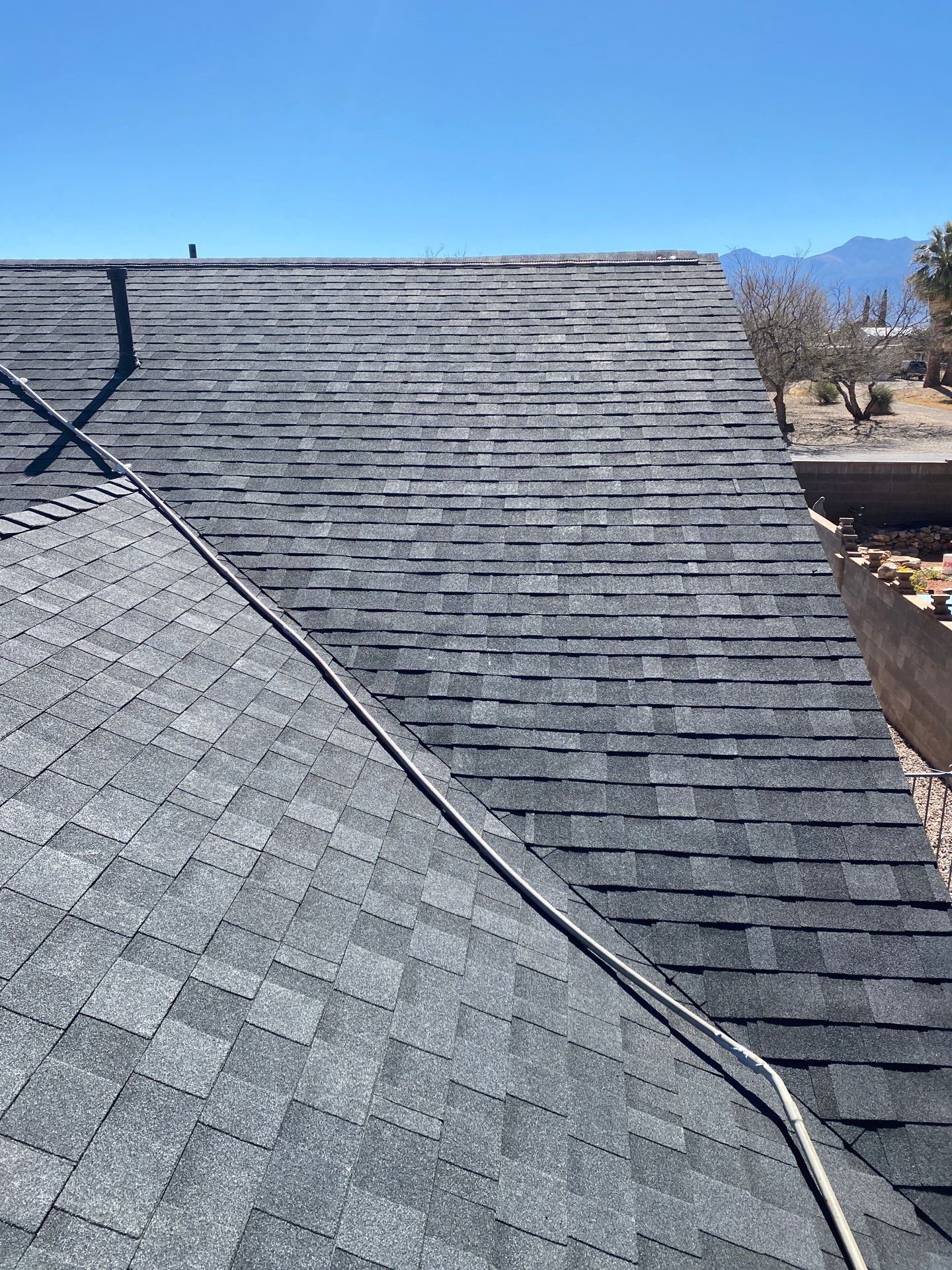 Onyx Black Shingles by Reimagine Roofing