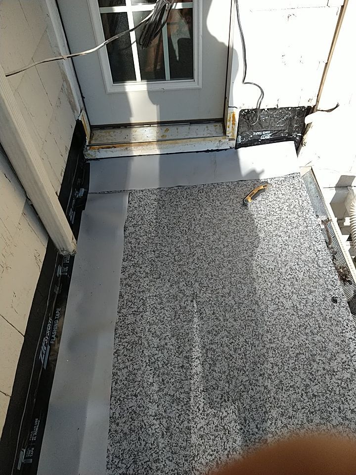 Residential Roofing Installation, Dec-tek walk-out porch roof, siding on garage by Absolute Roofing and Construction