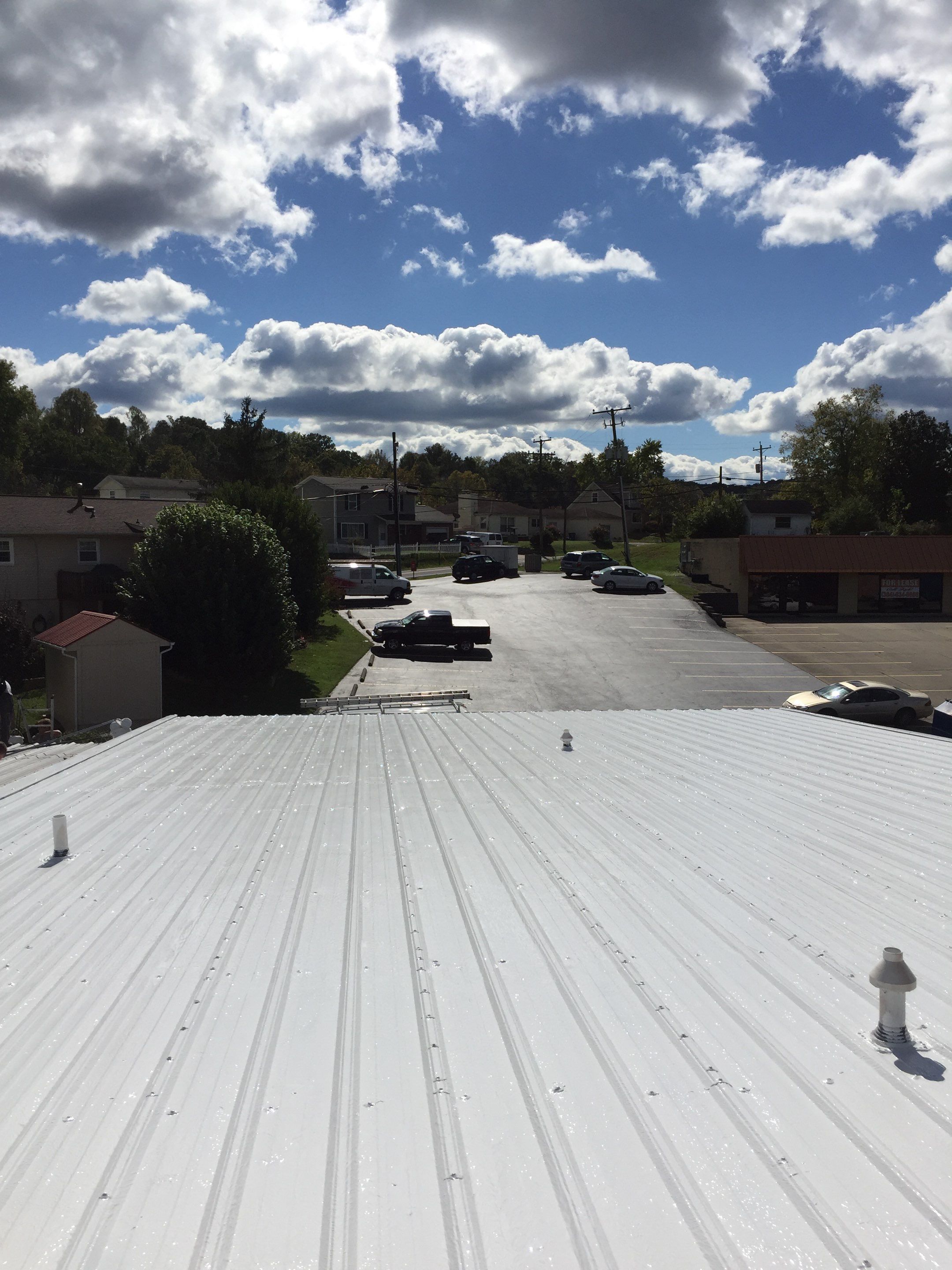 Commercial Roof Coating using Gaco Silicone Roof Coating by Secure Construction Company Inc