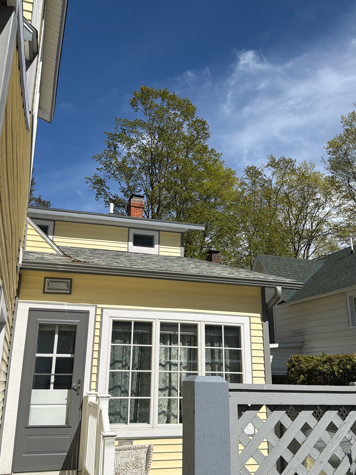 Dark Gray Aluminum Gutter System Installation in Harbor Springs by Rainbow Seamless Systems