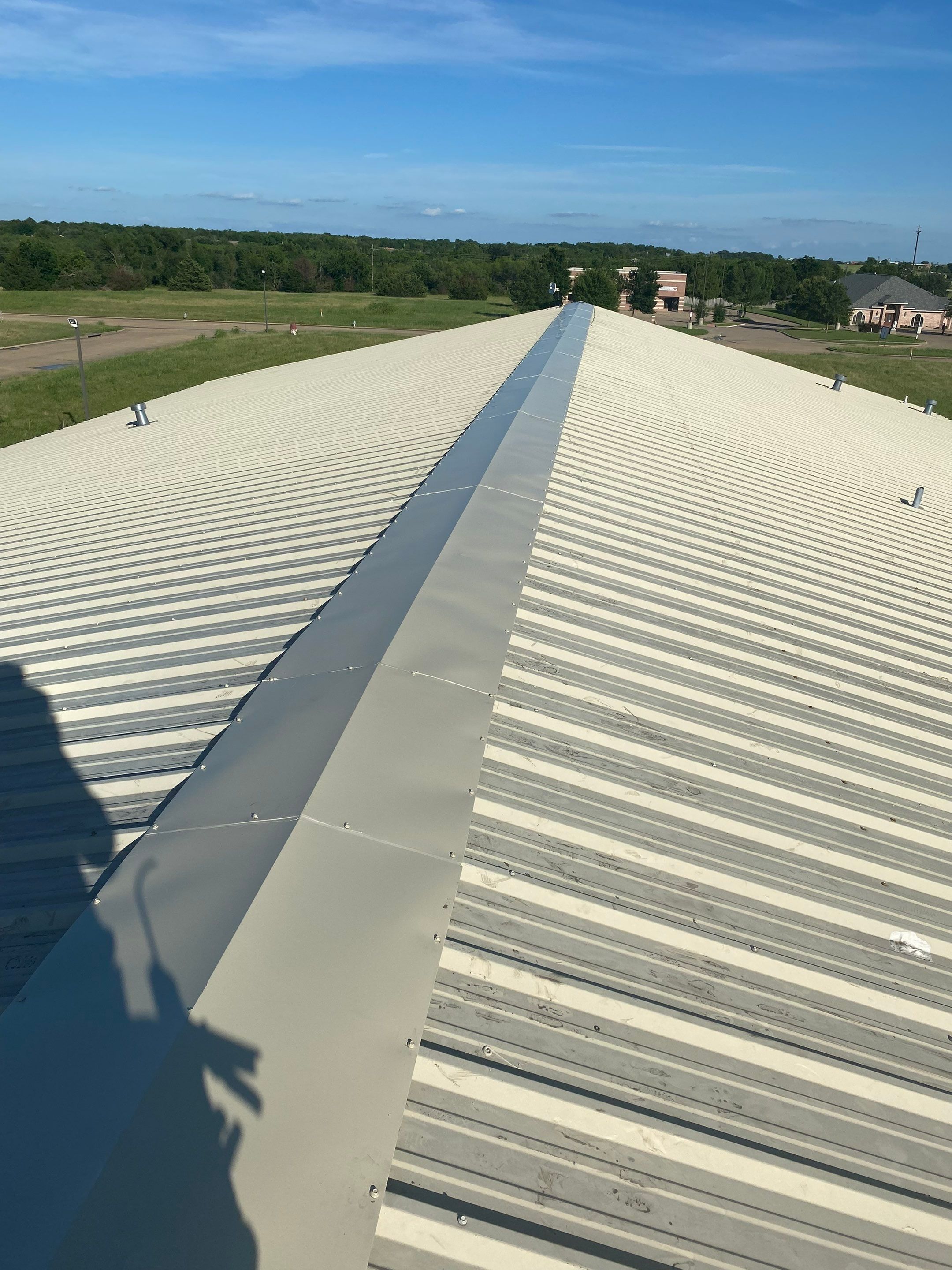 Drainage System Installation and Metal Roof Repairs by Harvey Roofing & Construction