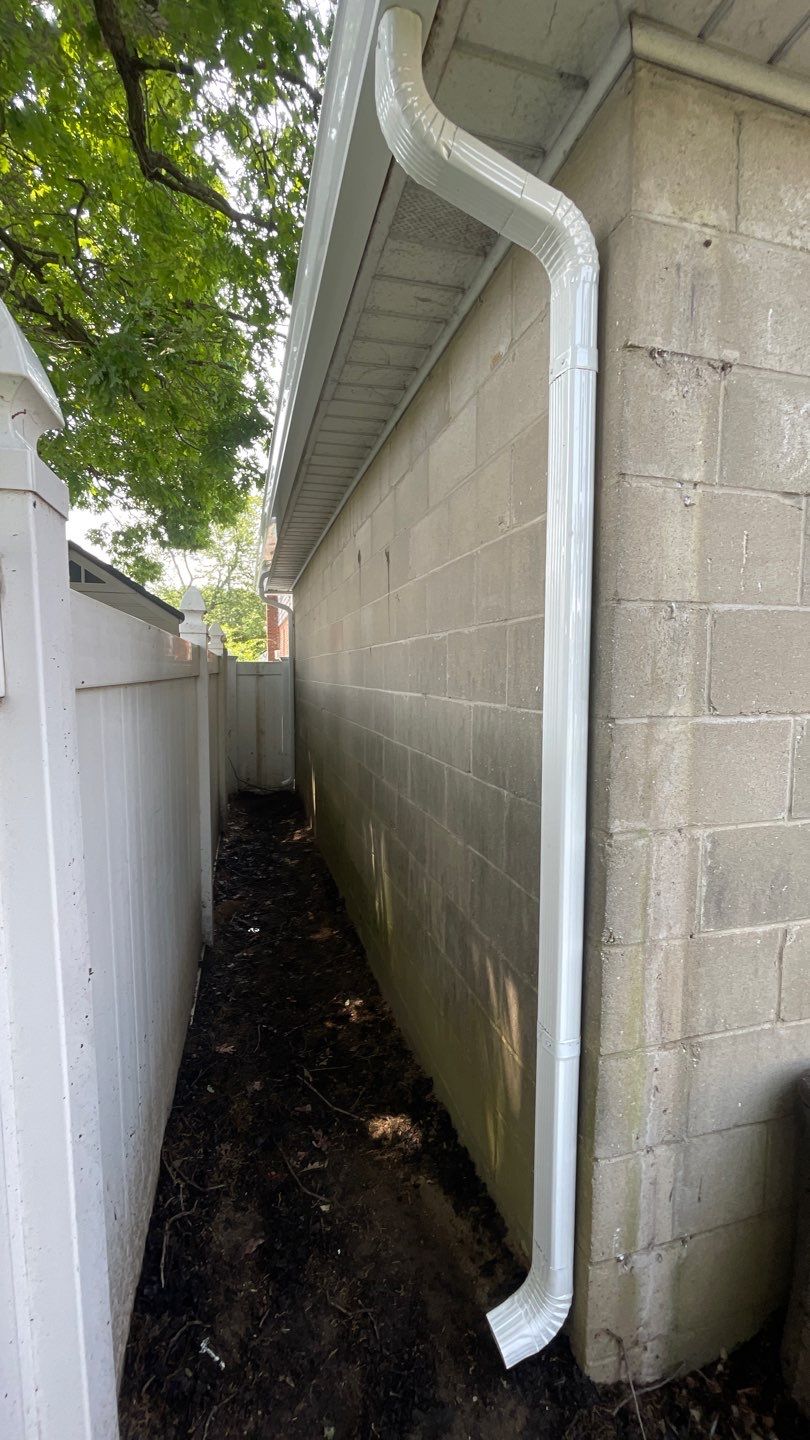 Gutter Installation using 5"white K style seamless gutters and 2x3 white leaders by Above All Gutters 