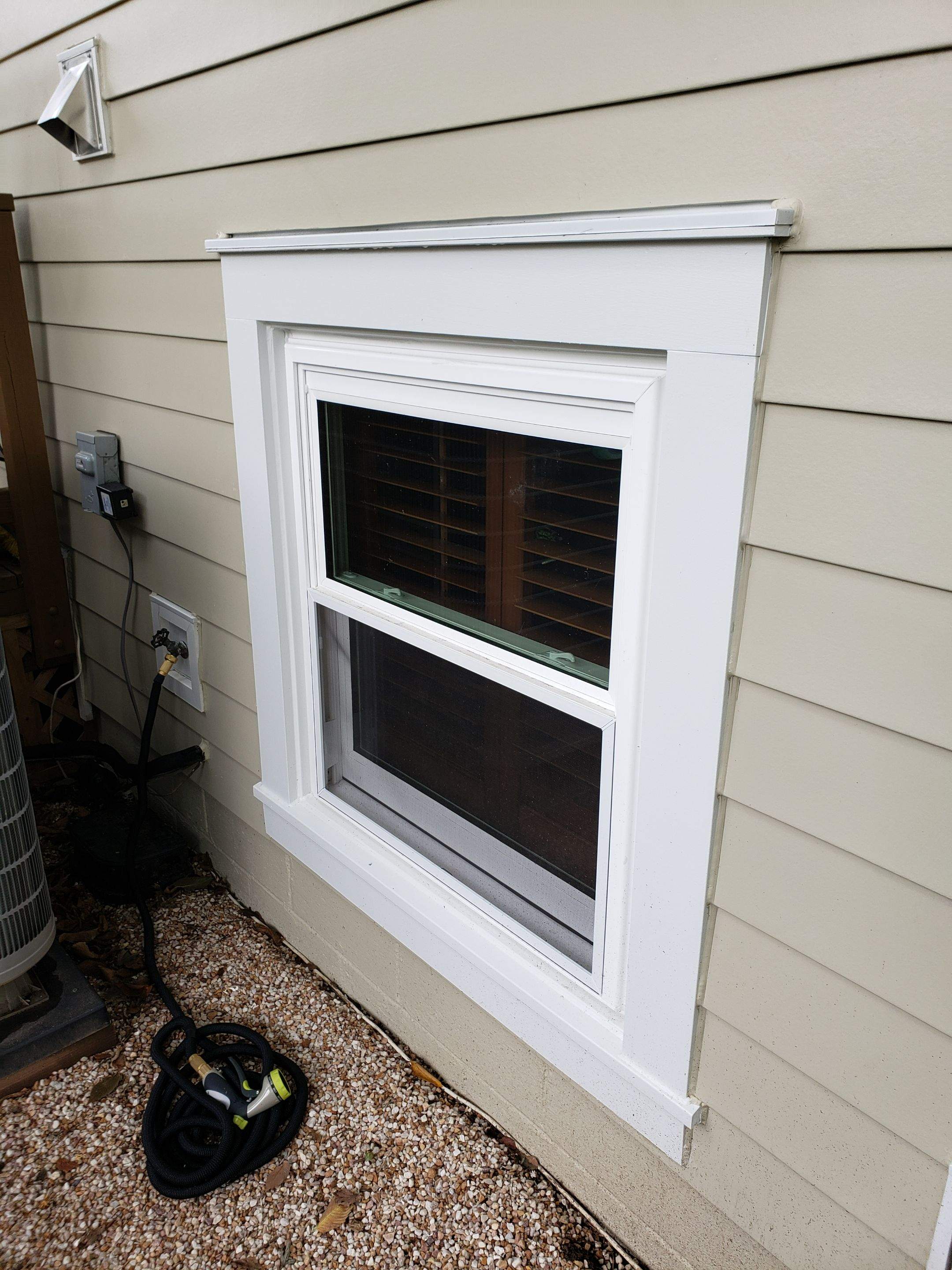 New composite windows and fiber cement siding with trim and gutters by Window Depot of Annapolis