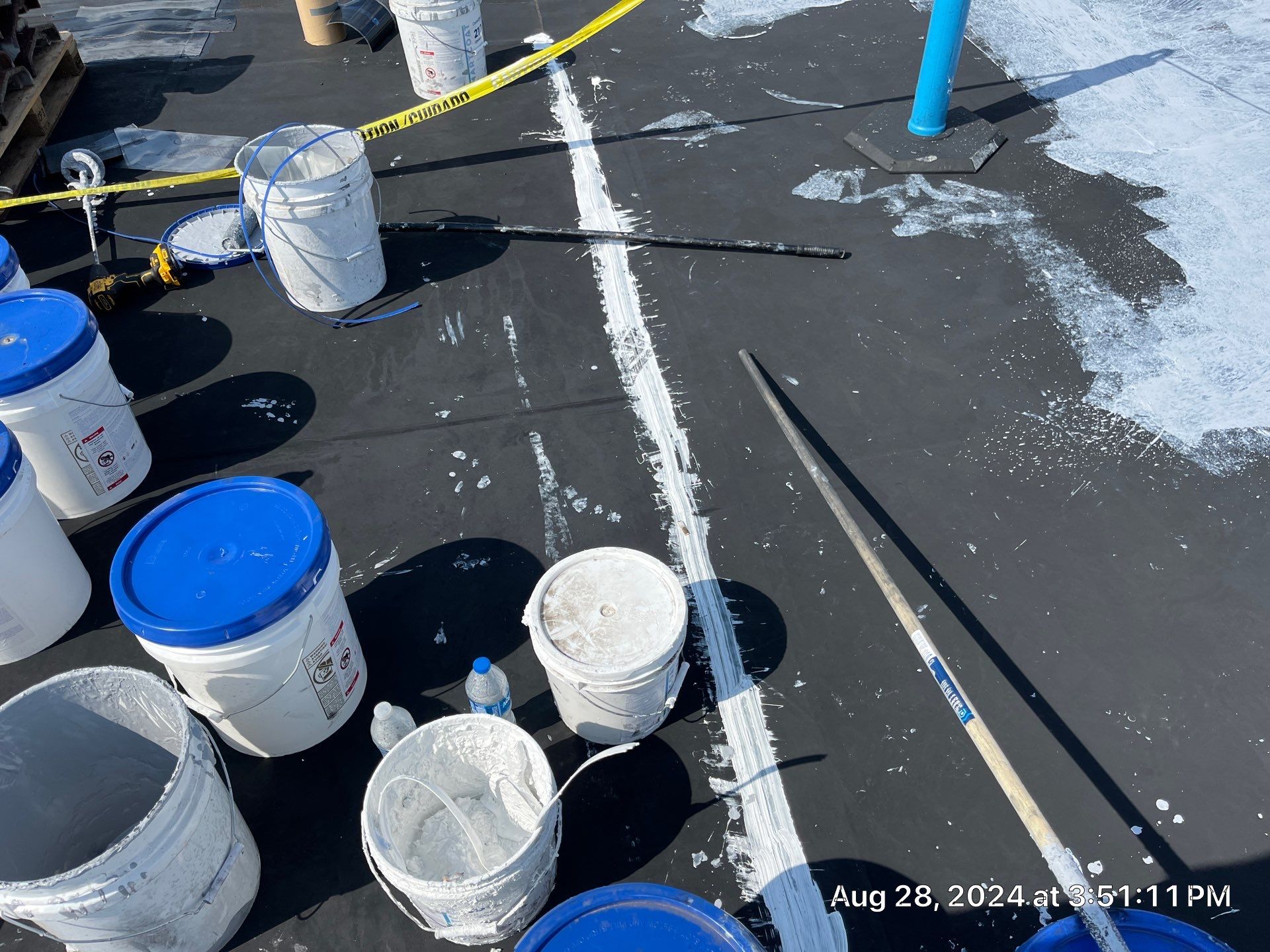 Commercial Roofing Installation using smartcoat Roof coating by Fahey Roofing + Contracting