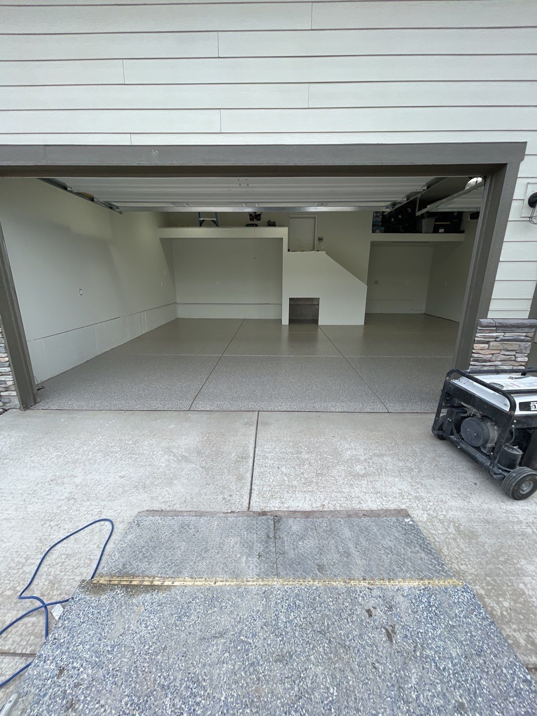 Garage Transformation using Pebble Beach by Croc Coatings, LLC
