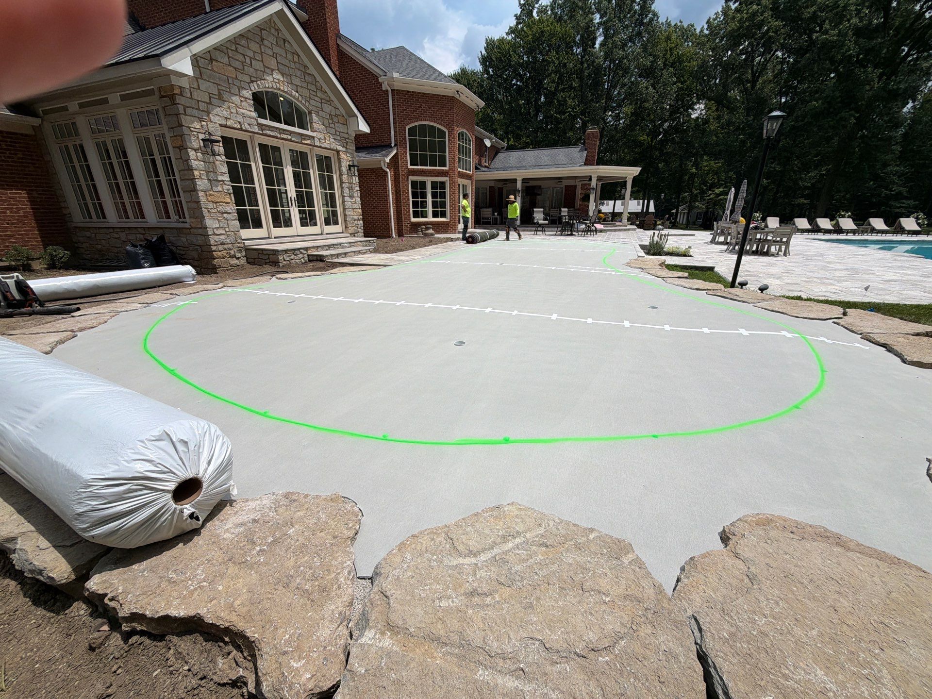 Custom Backyard Golf Green Accented by Flagstone Border in Morrow, OH by Southwest Greens Midwest