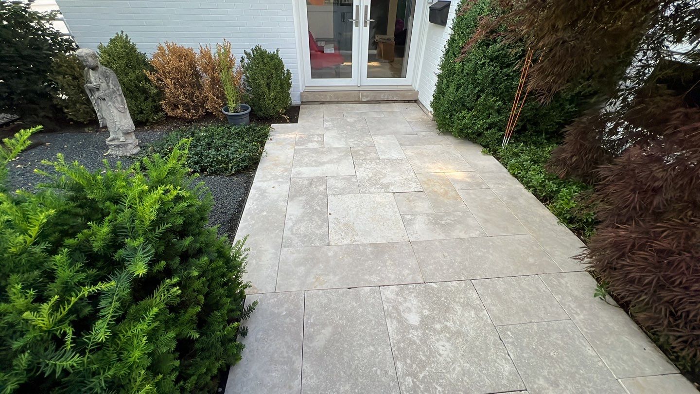 marble patio cleaning and sanding using Polysweep polymeric sand by Northern Power Washing LLC.