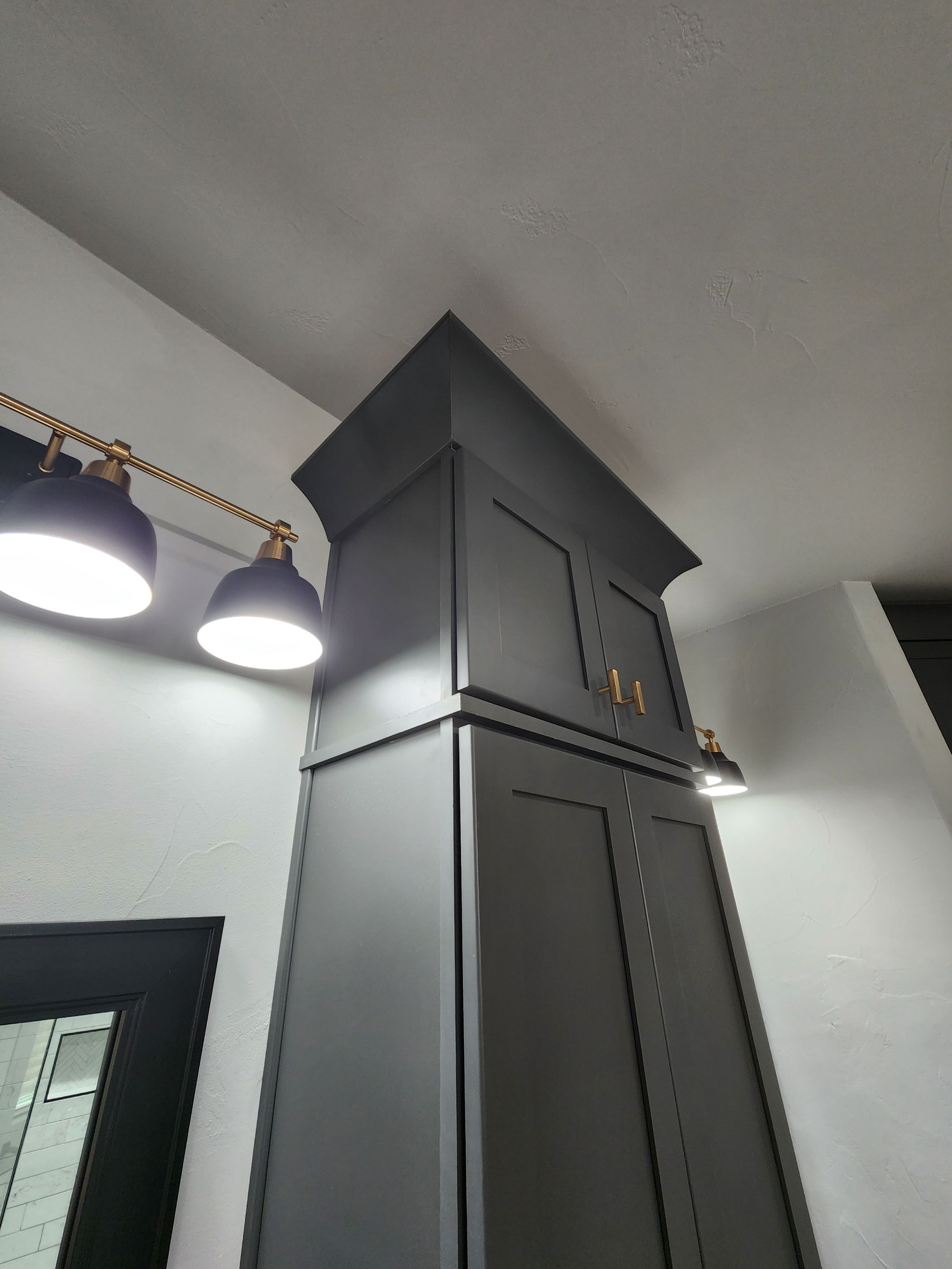 Spring Bathroom Remodel with Black Free-Standing Tub and Walk-In Shower by Legacy Bath and Kitchen