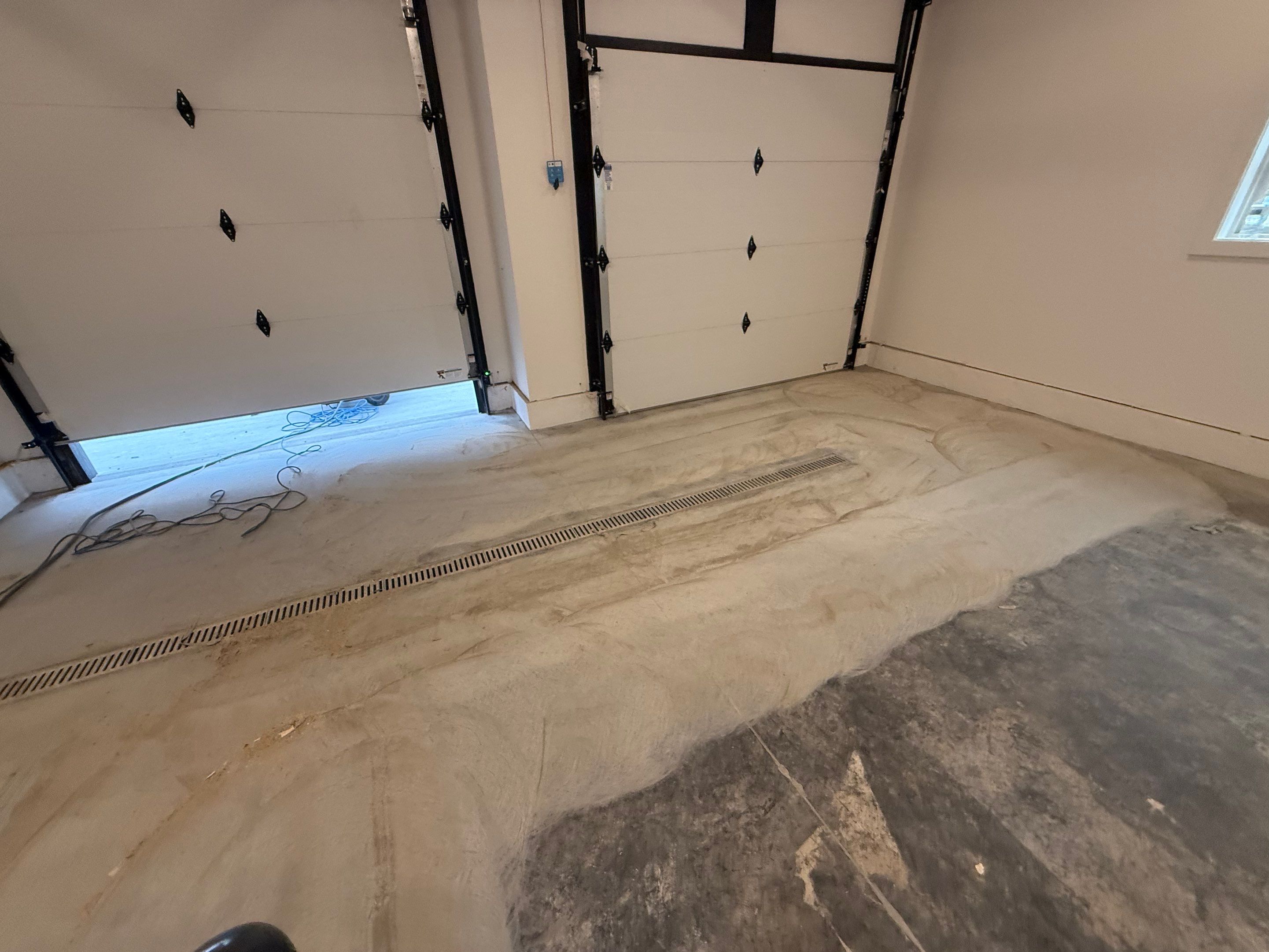 Multi-Car Garage Epoxy Floor Coating and Concrete Finishing in Sioux Falls by Select Painting, Coatings & Garage Cabinets