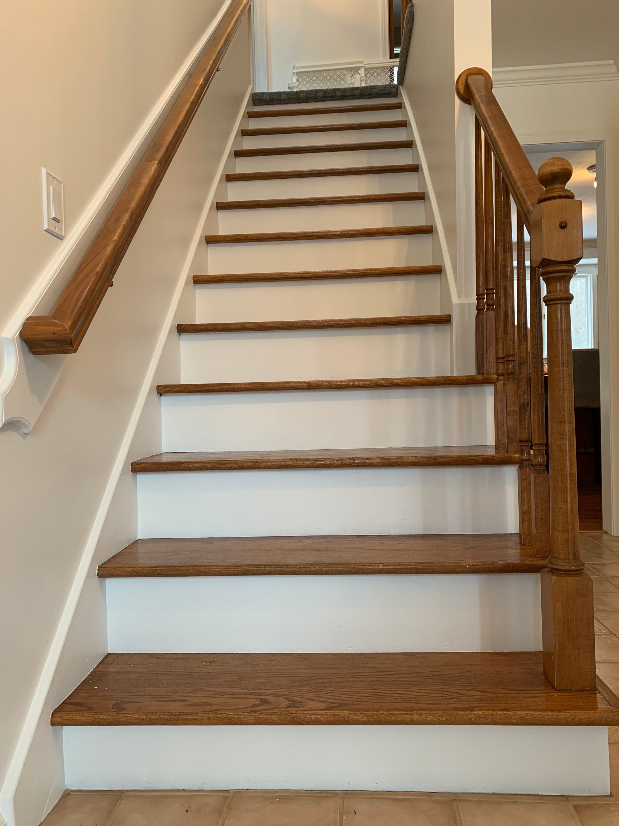 Painting Stained Wood Trim and Staircase. Walls too! by Empire Painting Services, LLC