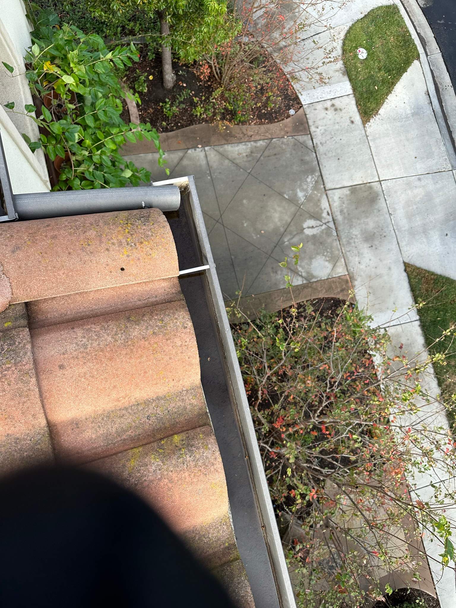 Clogged gutters at this Irvine home in Woodbury by Property Cleaning Experts