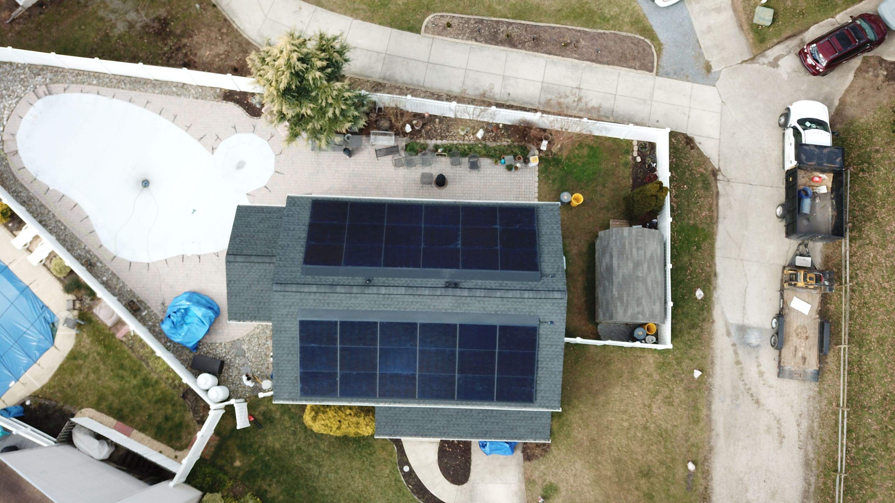 Roof Replacement with GAF Decotech integrated solar panels by American Home Contractors