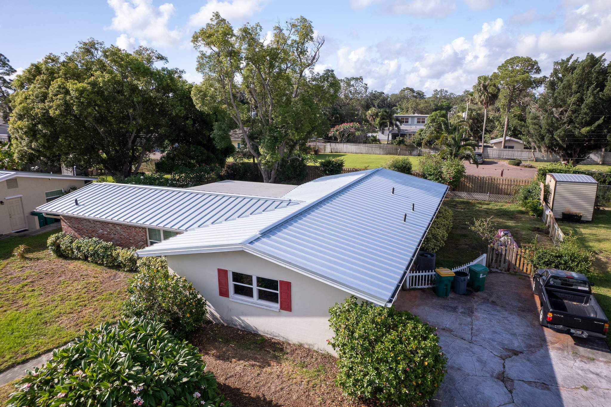 Standing Seam Metal Roof Replacement and New Gutters in Merritt Island by Wiedmann Construction & Roofing