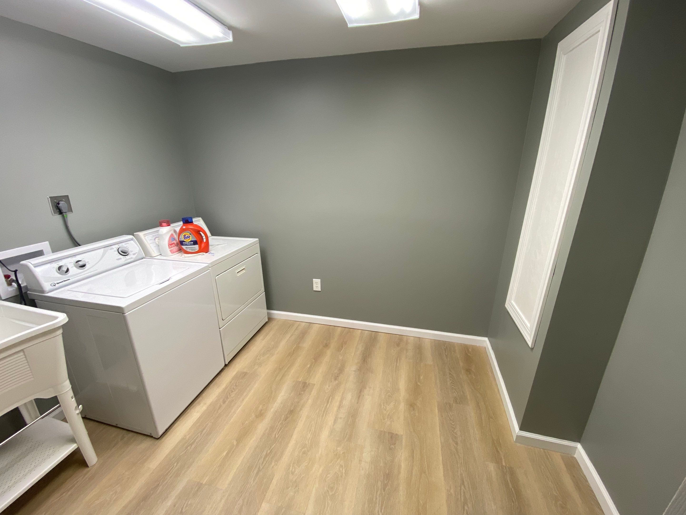 Laundry Room Redmodel using Lifeproof Luxury Vinyl Plank Flooring by The Smet Companies, LLC