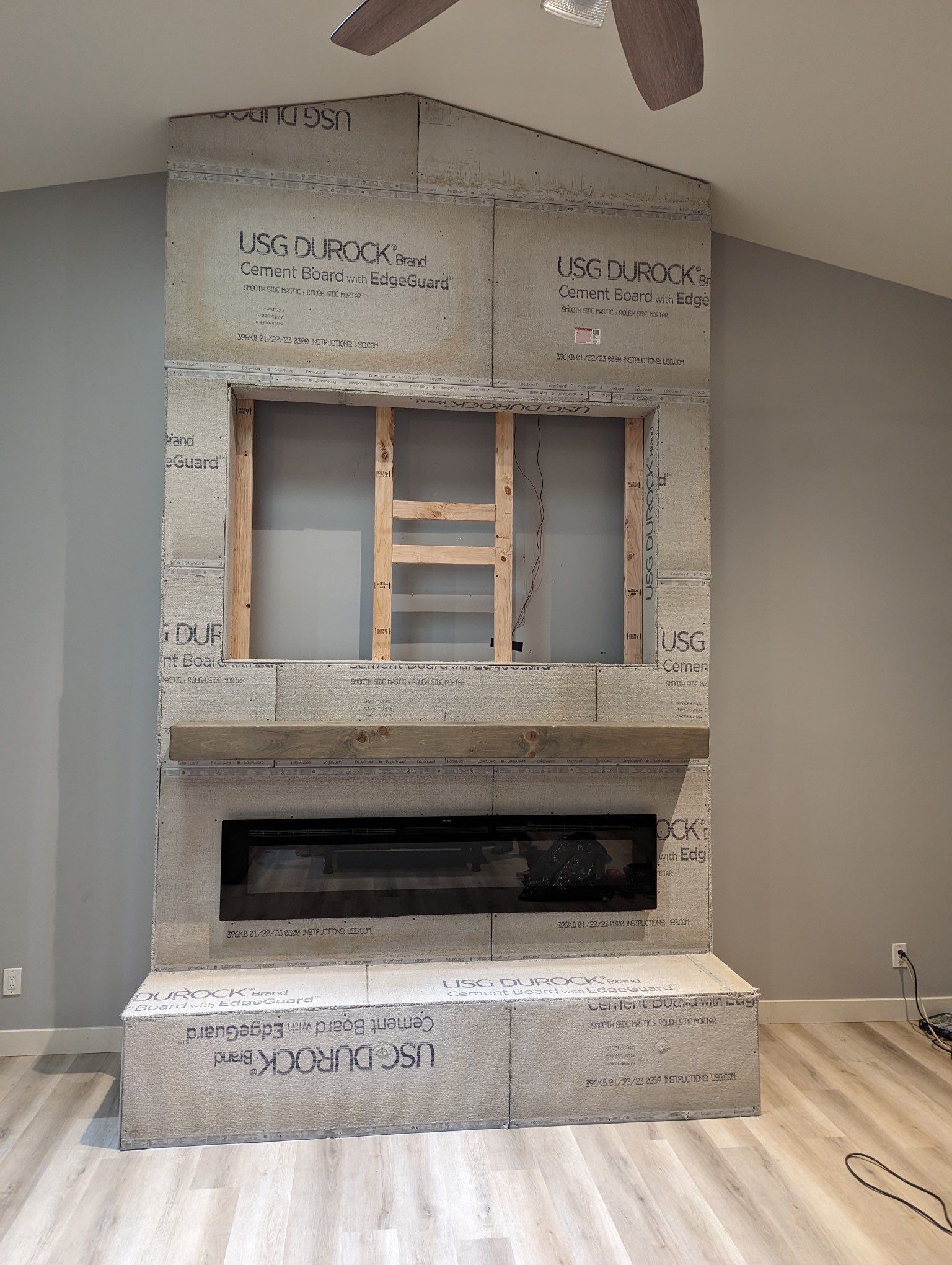 Stacked Stone Electric Fireplace by Footprints Floors of Chandler 