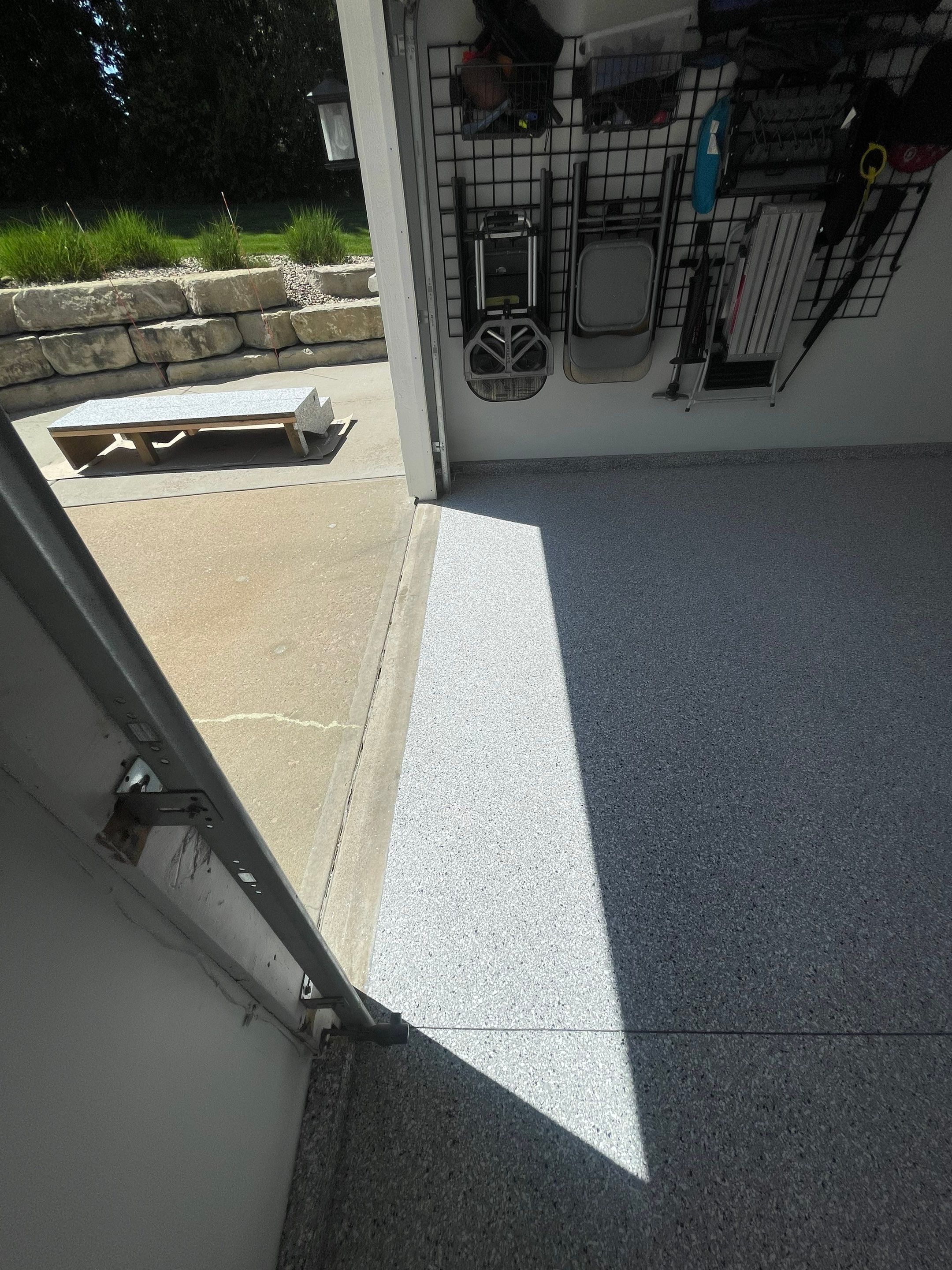 Feather Grey Garage Floor Coating Installation in Sioux Falls by Select Painting, Coatings & Garage Cabinets
