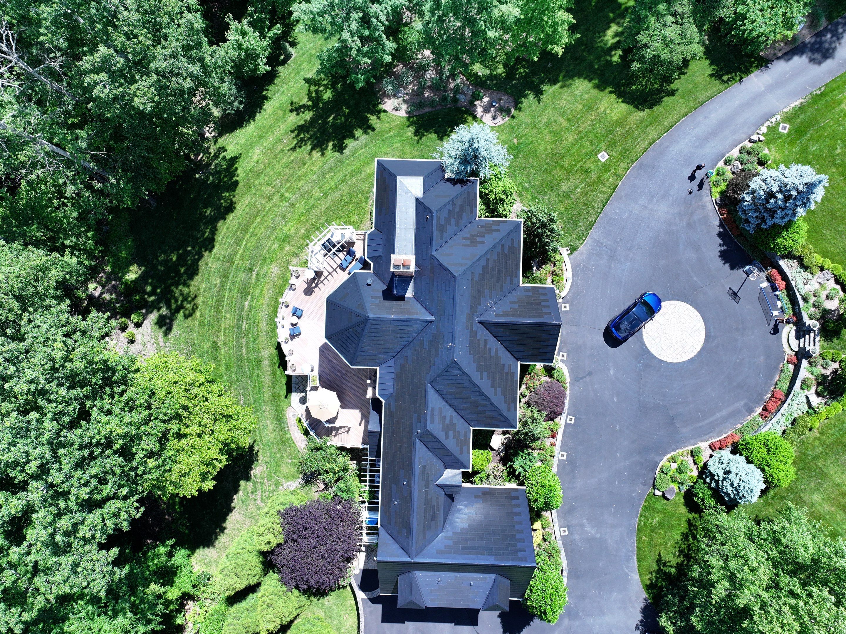 Tesla Solar Roof Replacement by American Home Contractors