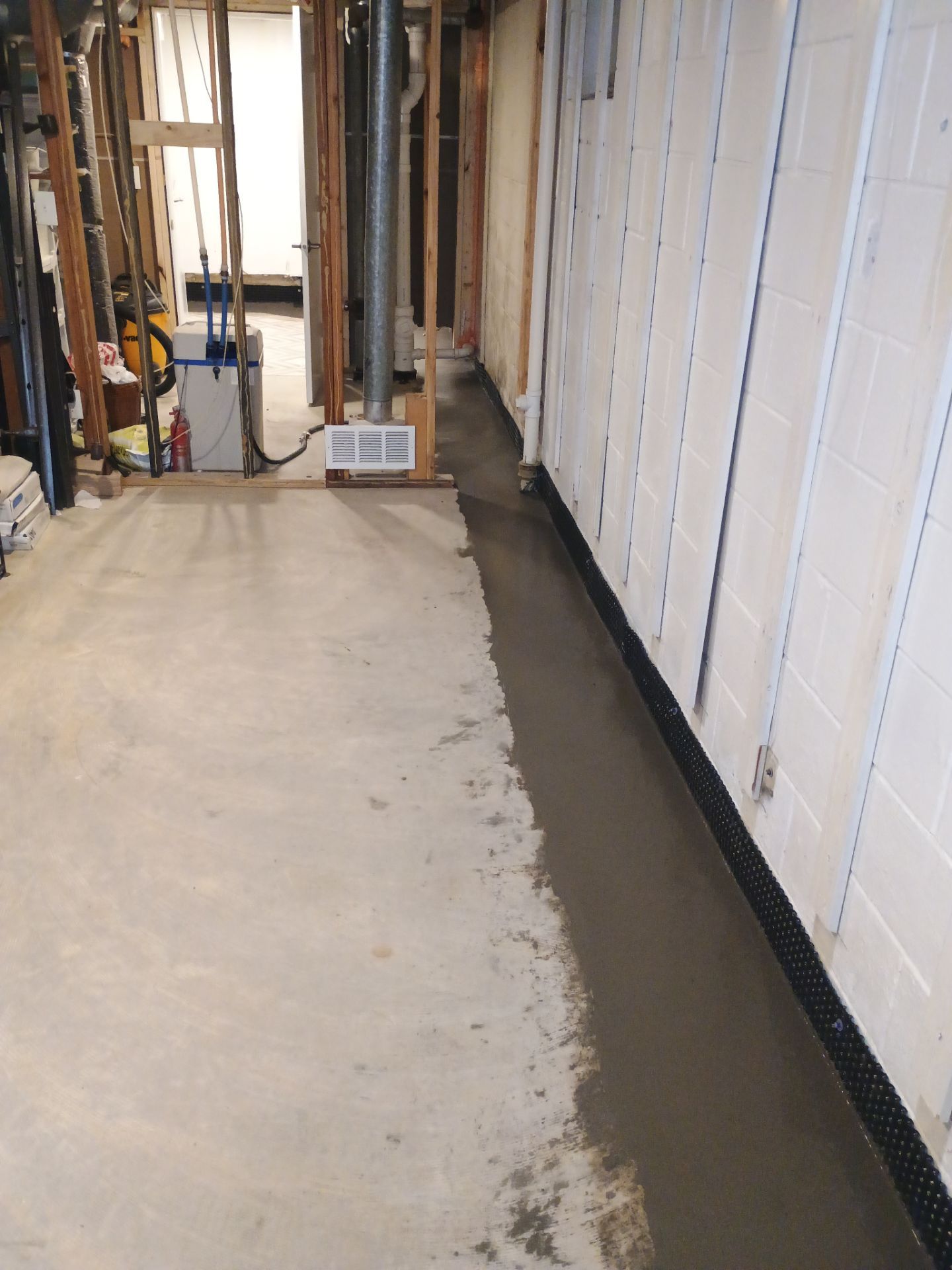 Interior Drain Tile & Buried Discharge in St. Anthony, MN by Waterproofing Northeast
