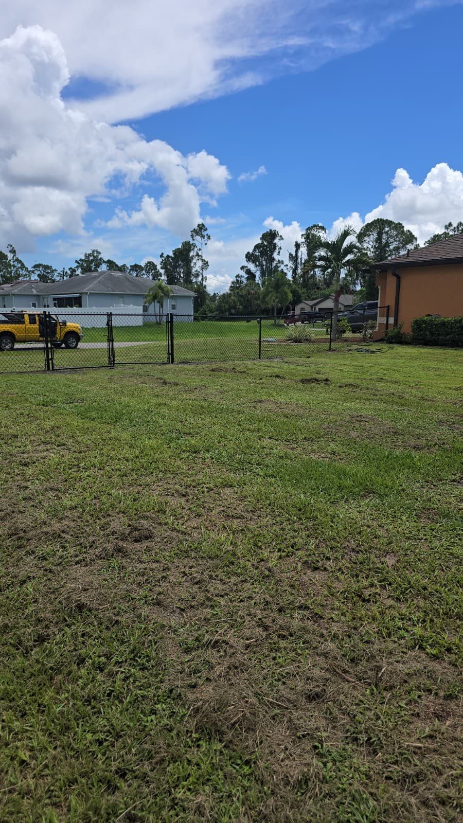 Black Chain Link Perimeter Fencing for North Port Residential Property by True Fence LLC