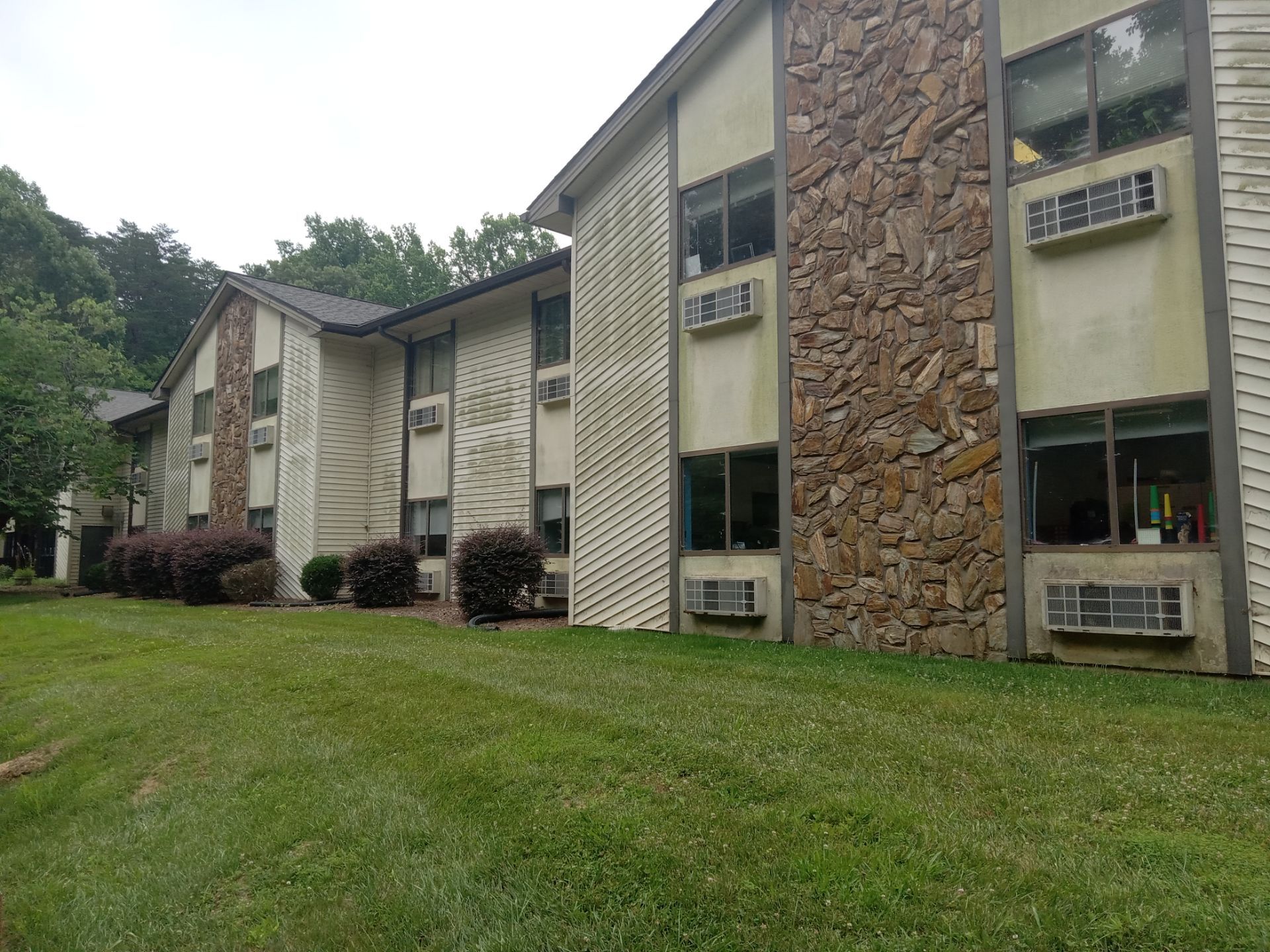 pressure washing siding stone surfaces exterior cleaning for building maintenance and curb appeal improvement