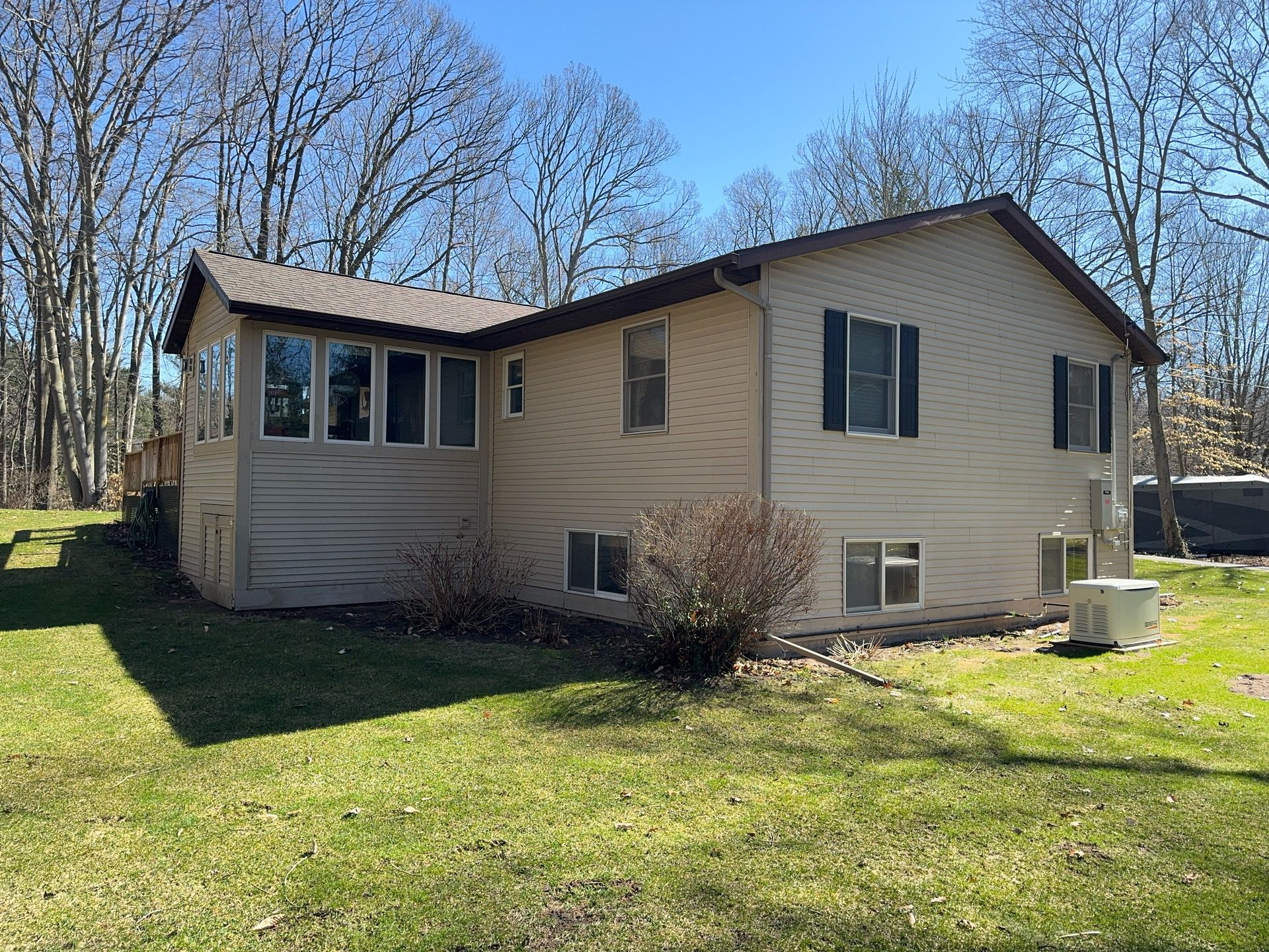 Siding, Deck and Versetta Stone by Avalon Roofing and Exteriors