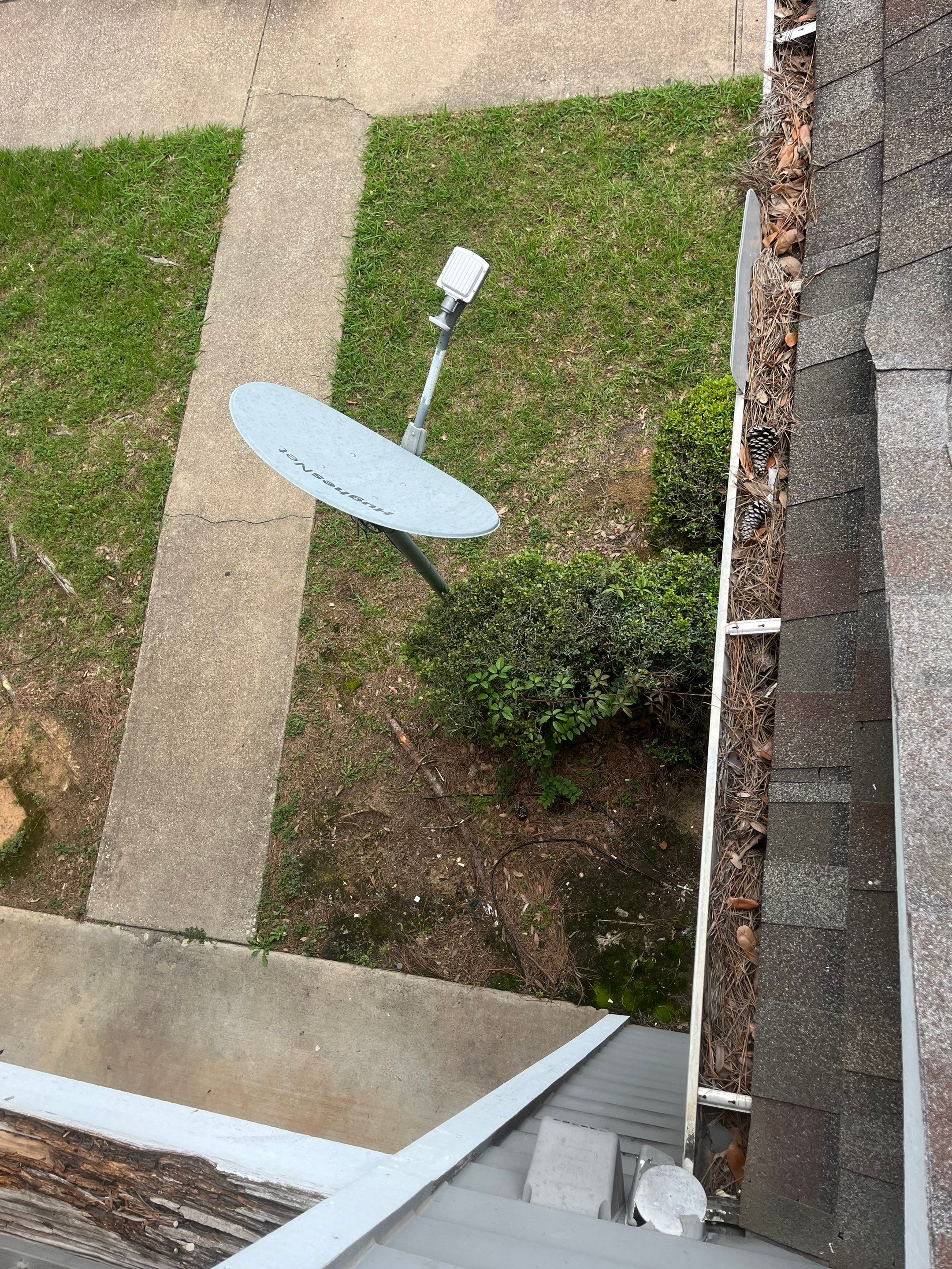 Commercial gutter cleaning Tyler & Longview before photo with filled gutters