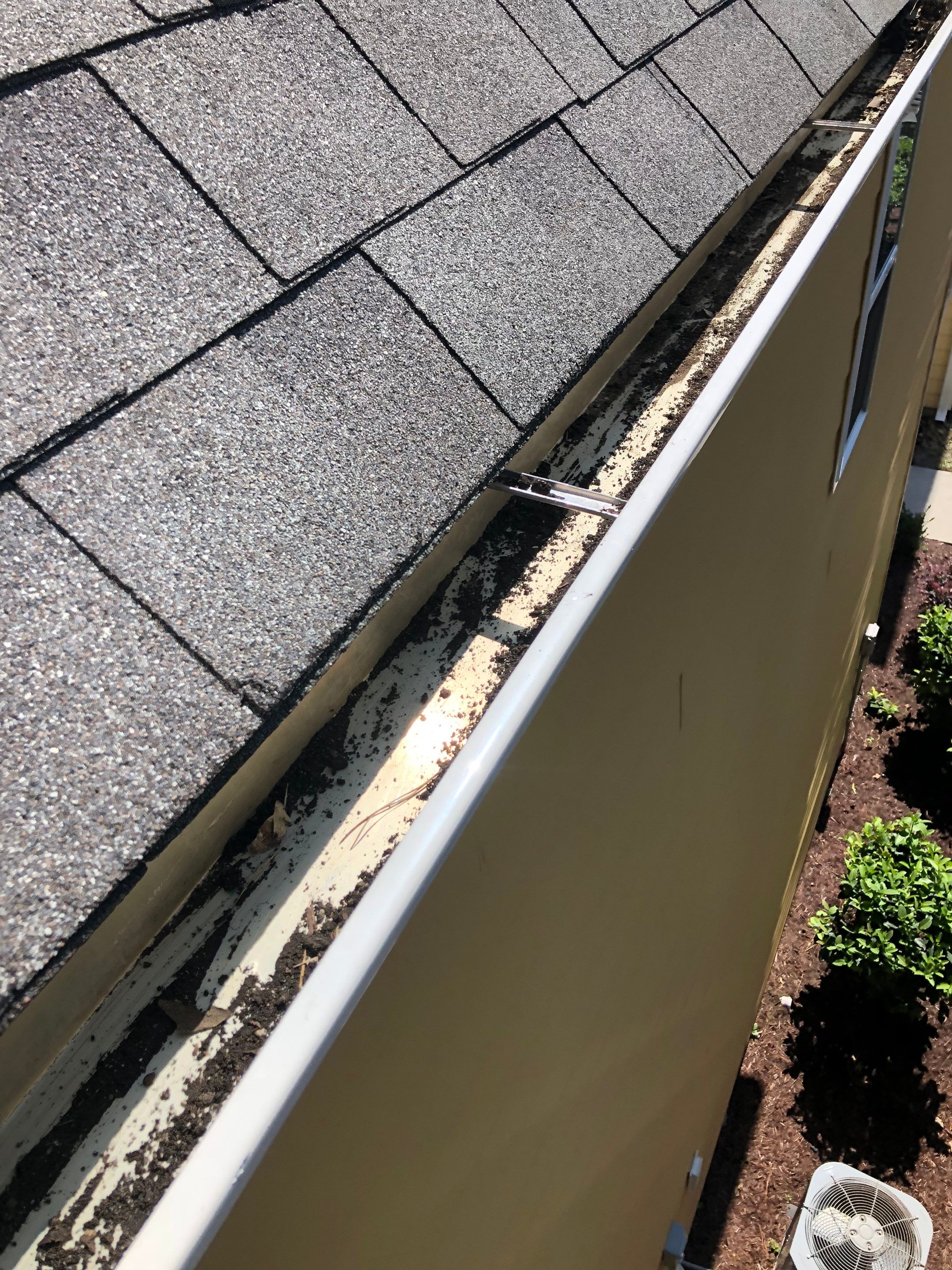 HOA gutter cleaning in Conway, SC, SC after  photo showing full gutters.