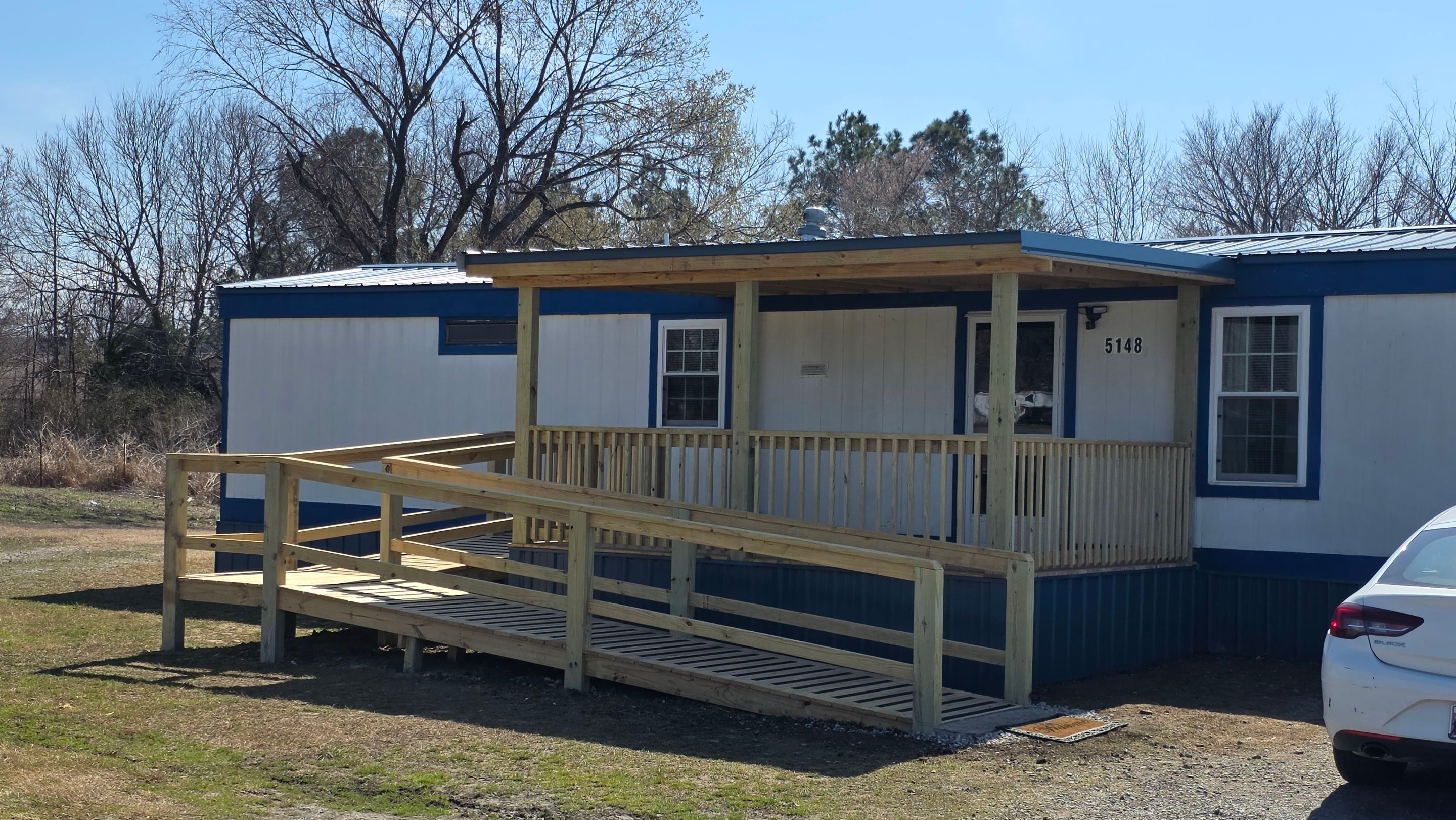 Covered Deck w/ ADA Ramp by In & Out Construction & Remodeling, LLC