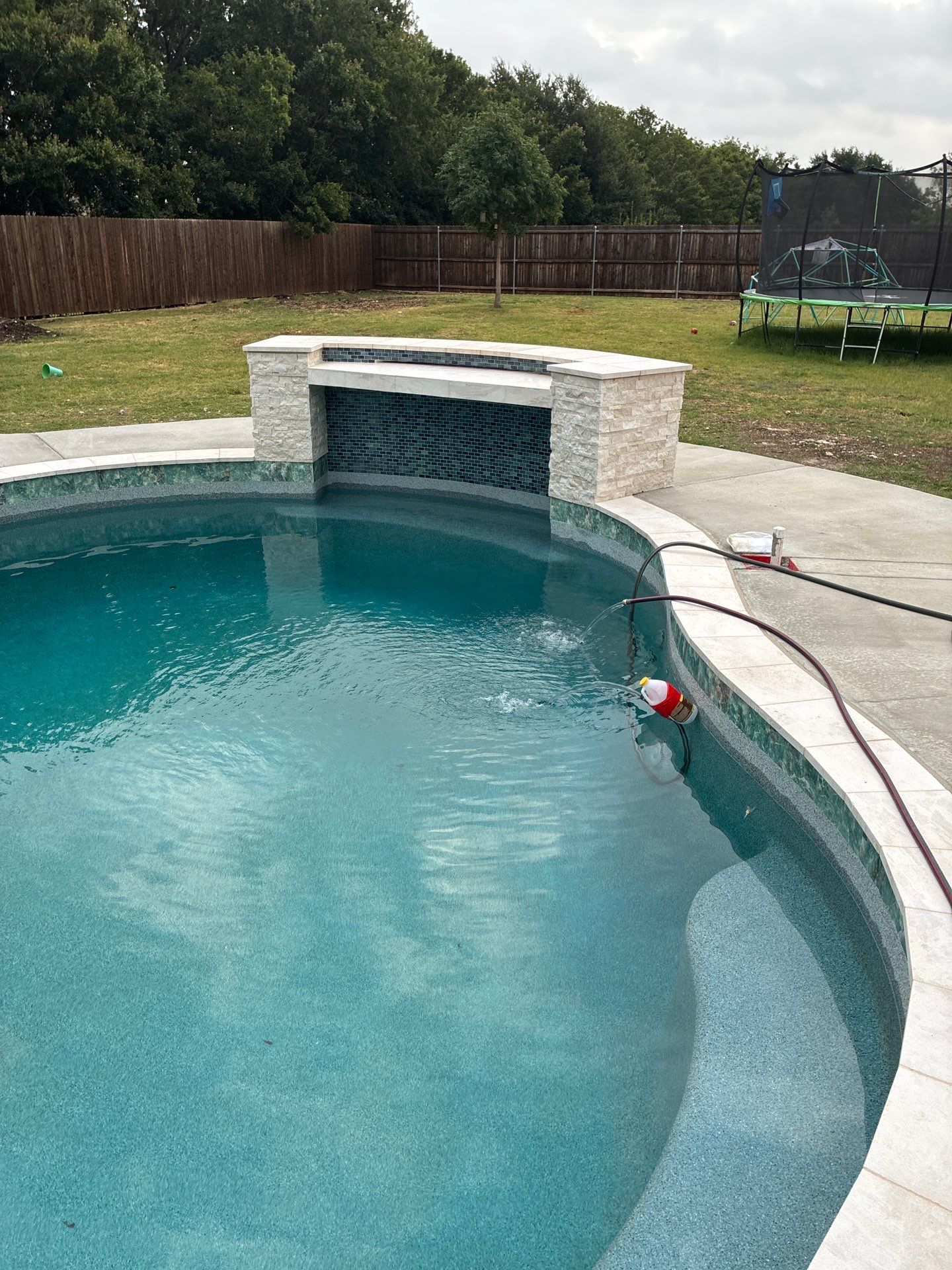 Freeform Pool with Raised Spa and Fire Feature by Pinnacle Pools and Spas - DFW