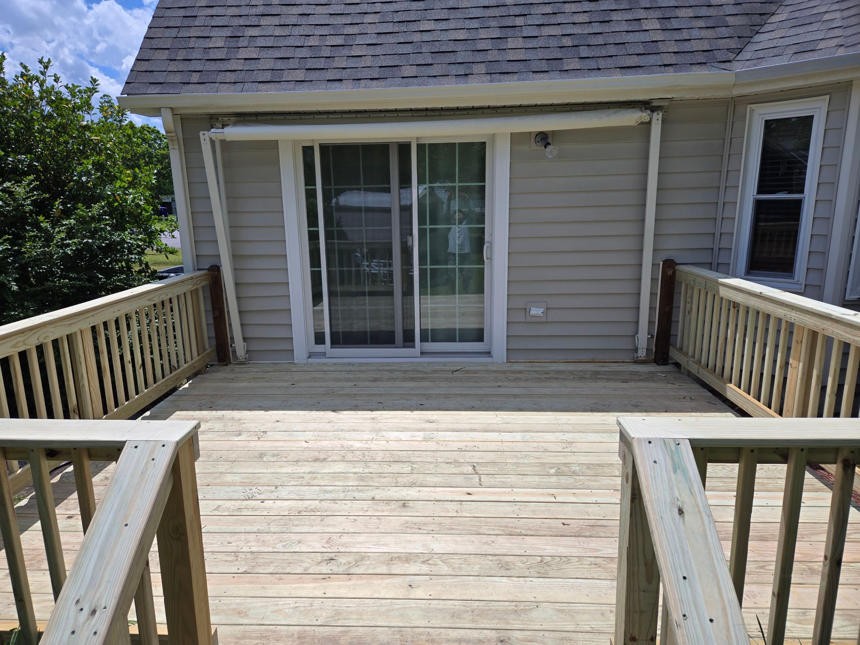 Pressure-Treated Wood Deck Resurface and Railing Upgrade in Havelock by The Remodeling Company