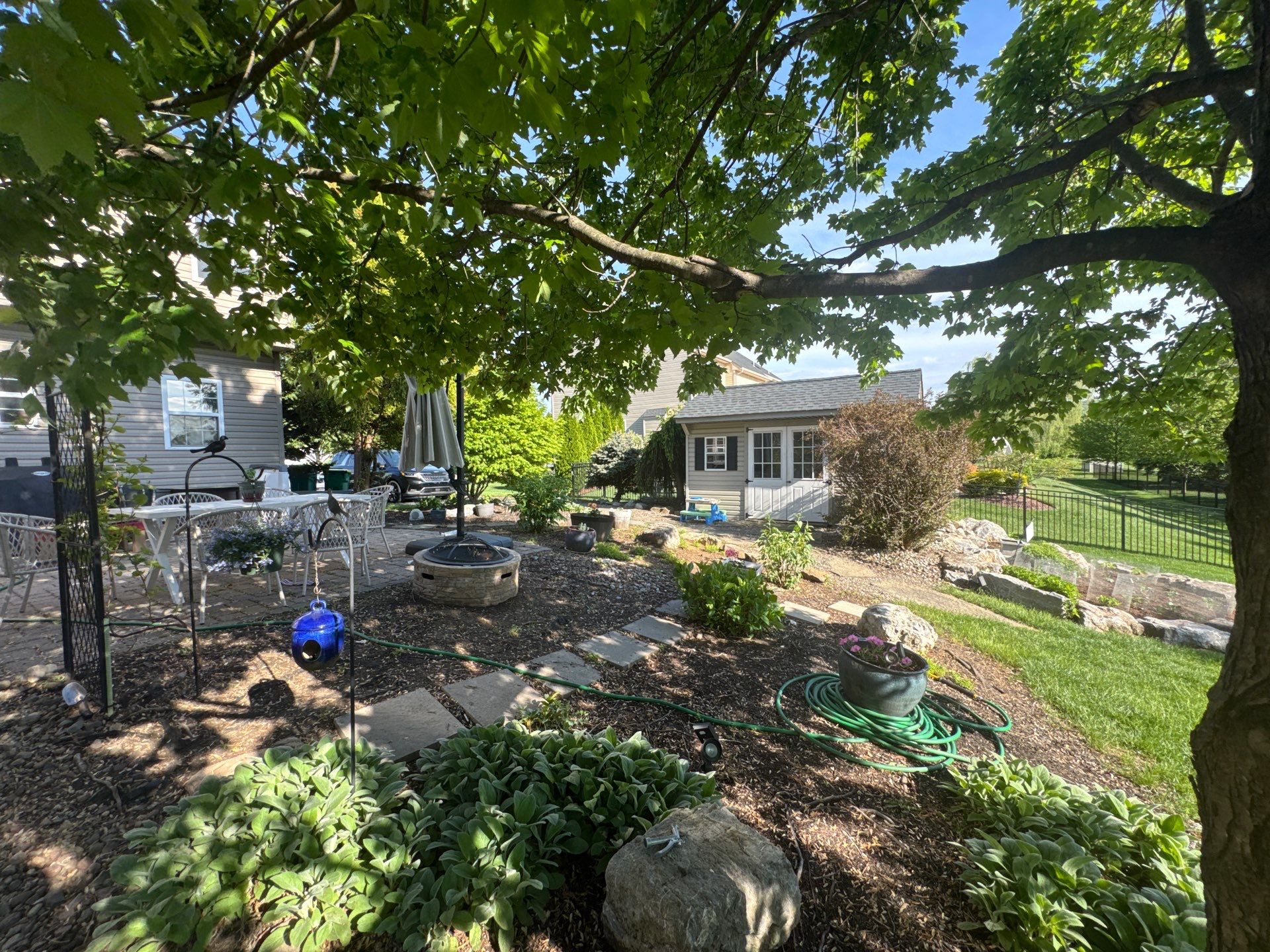 Backyard Retreat: Techo-Bloc Patio + Firepit Lounge by Saylor’s Lawn & Landscape