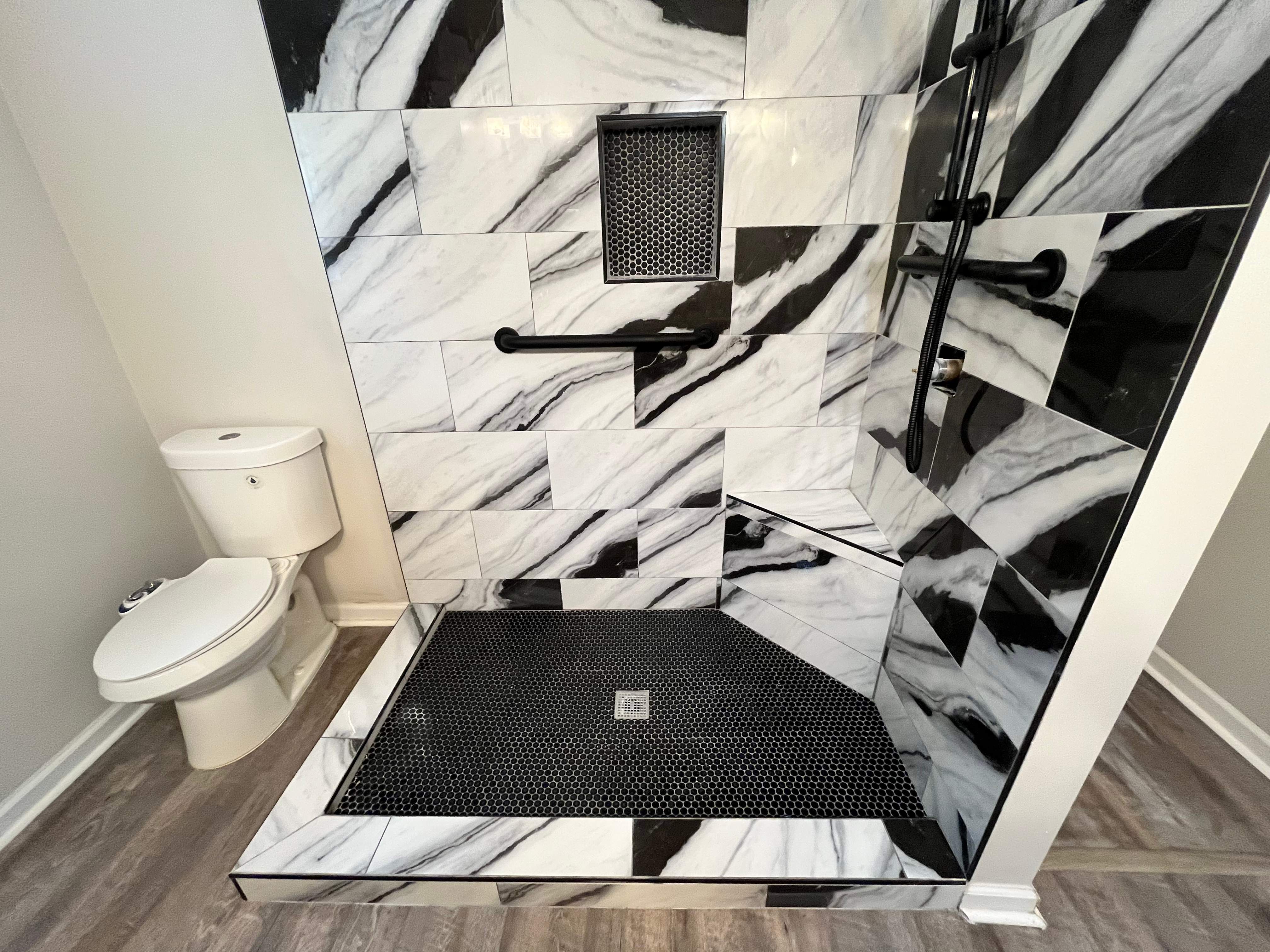 Tub to walk-in shower conversion by Prudencio
