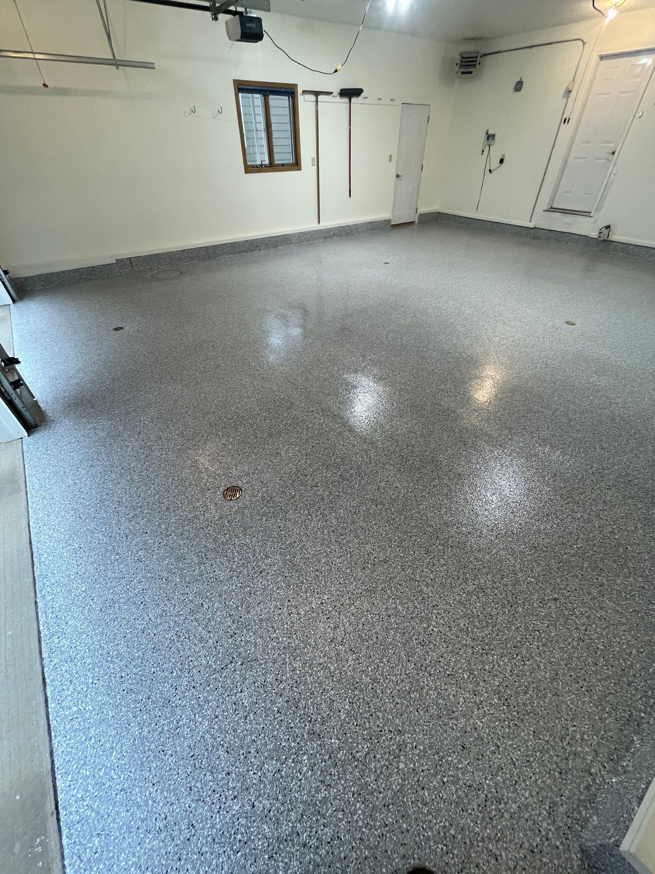 Madison Garage Concrete Coating with Feather Grey Speckle Finish by Select Painting, Coatings & Garage Cabinets
