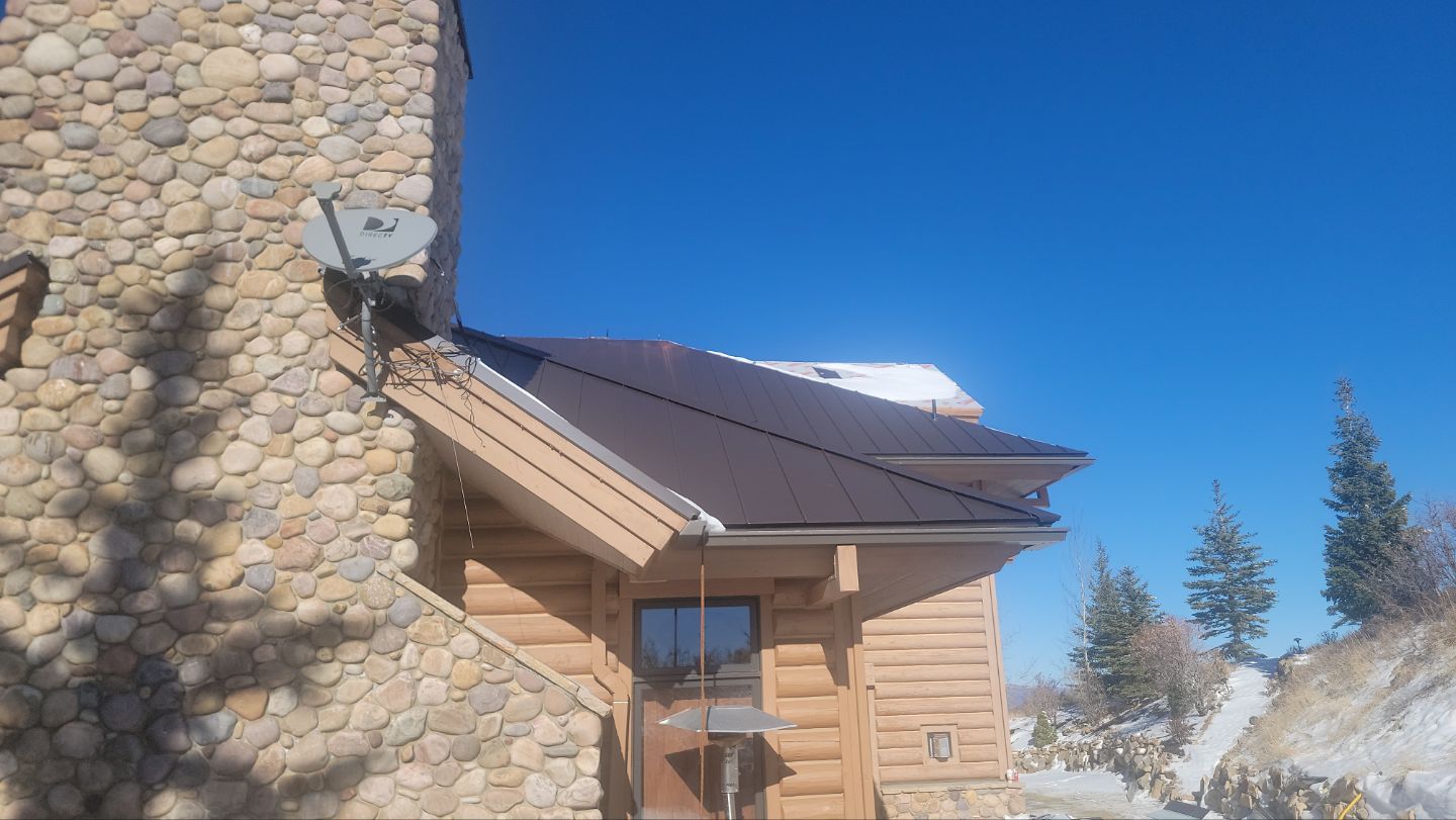 Standing Seam Metal Roof Replacement After Snow Damage by ASAP Roofing & Restoration