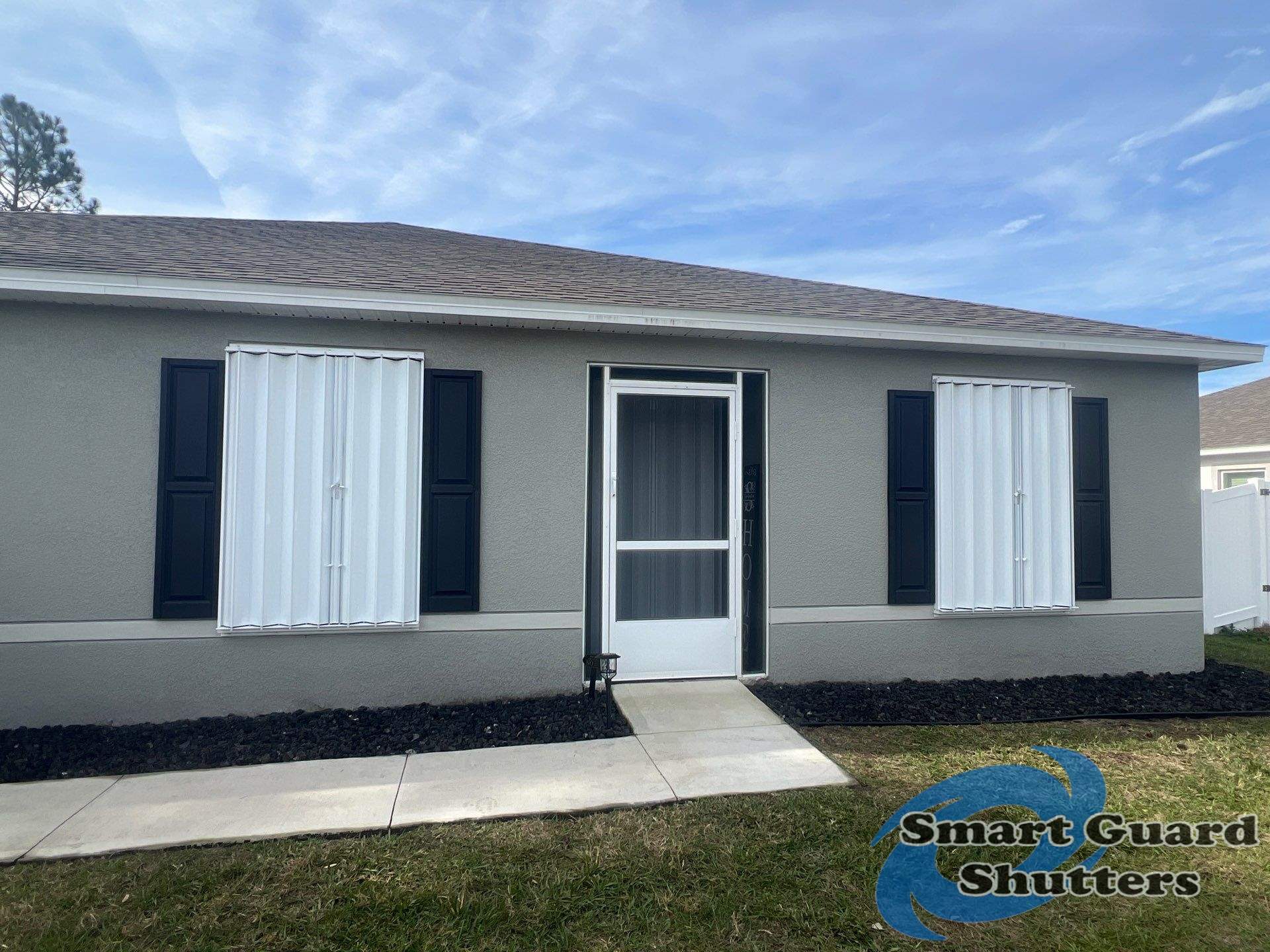 Accordion Shutters in White by Smart Guard Shutters