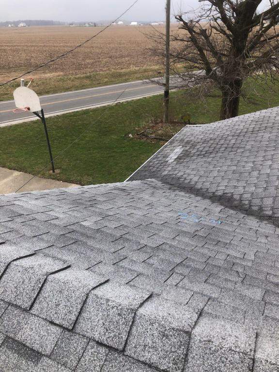 Storm damage roof replacement by Nitro Roofing and Construction