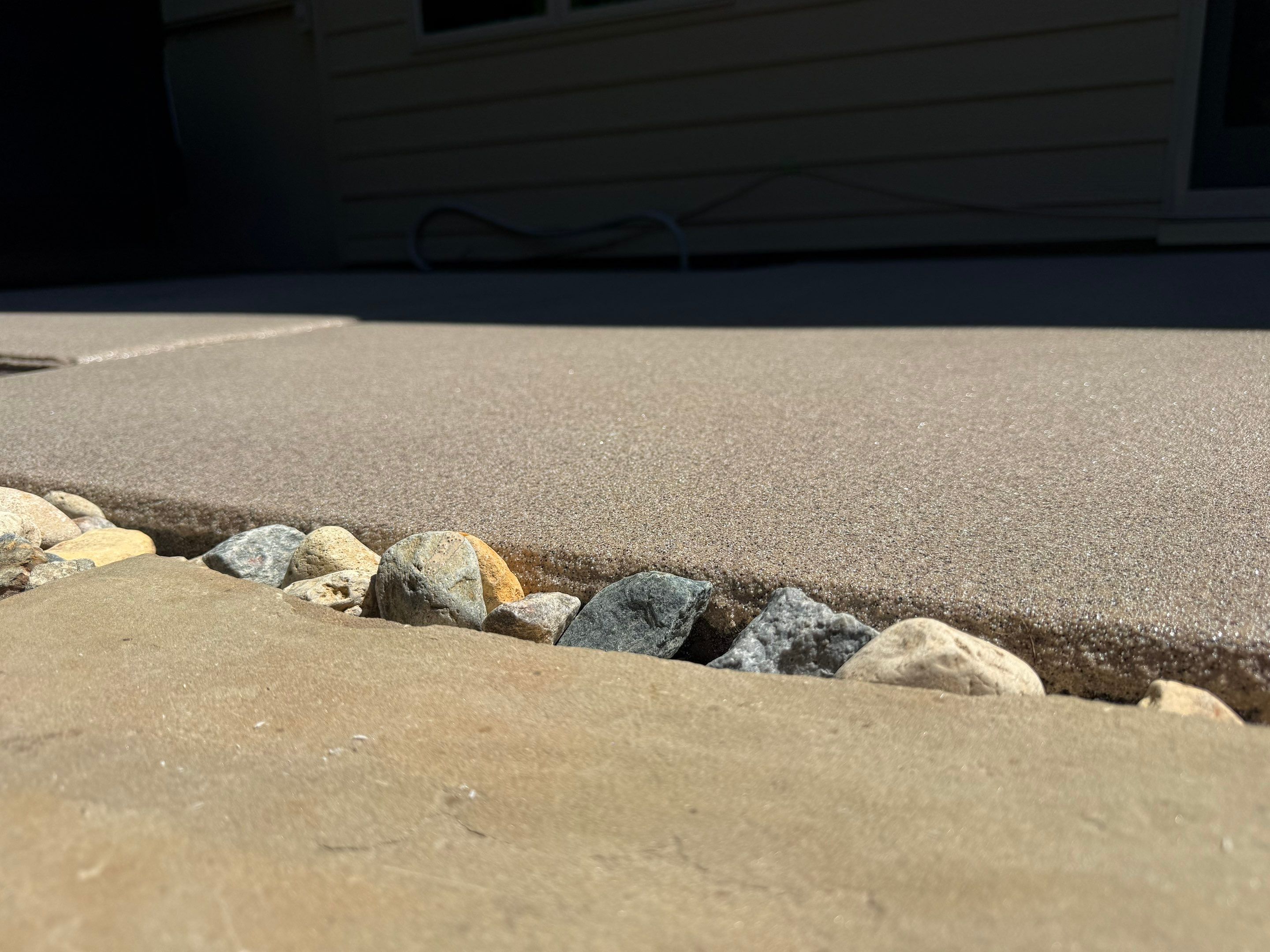 Textured Concrete Coating and Paver Patio Refresh in Sioux Falls by Select Painting, Coatings & Garage Cabinets