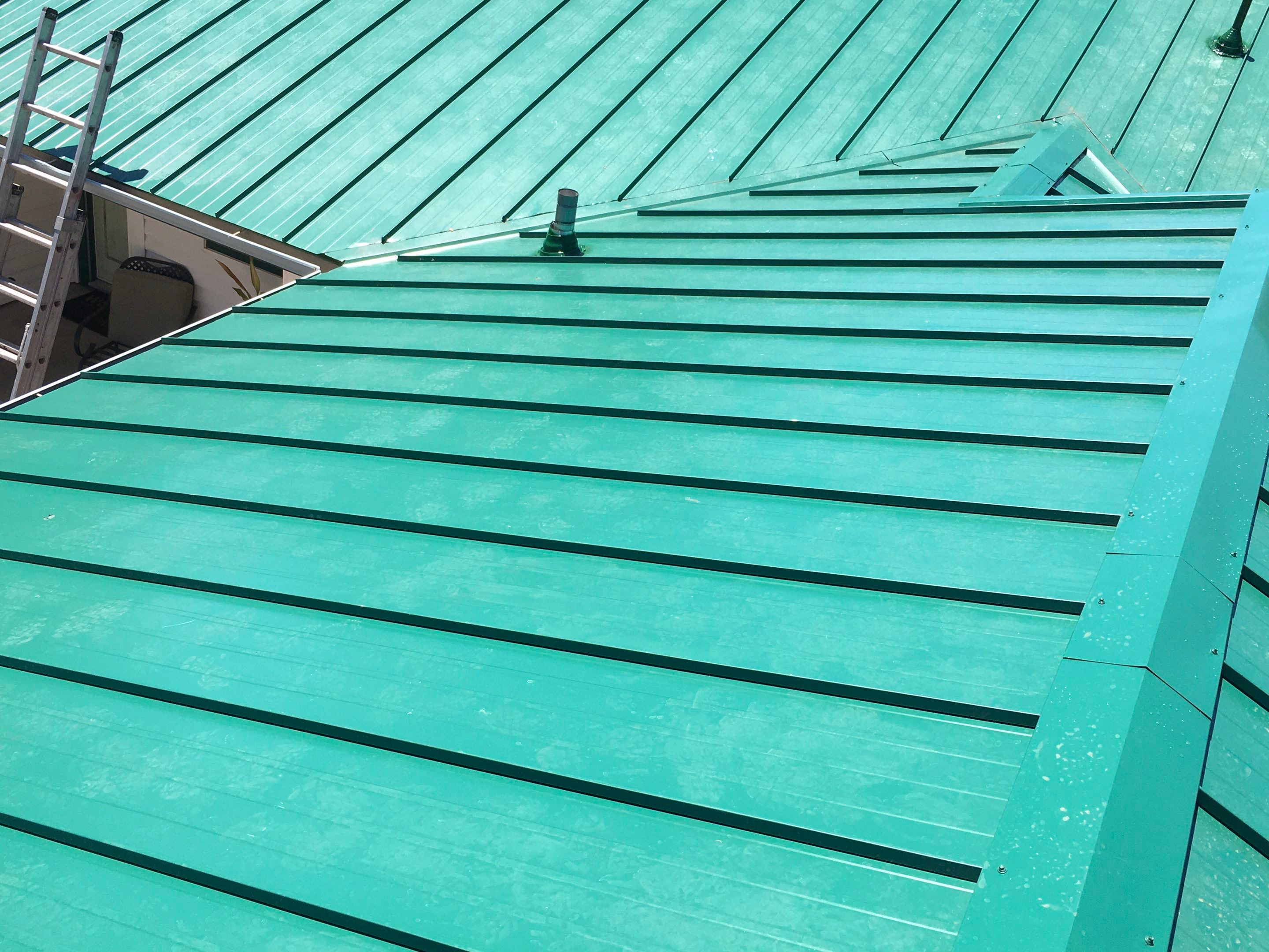 Metal roofing installation using Standing seam metal roofing system by Straight Edge Roofing Inc