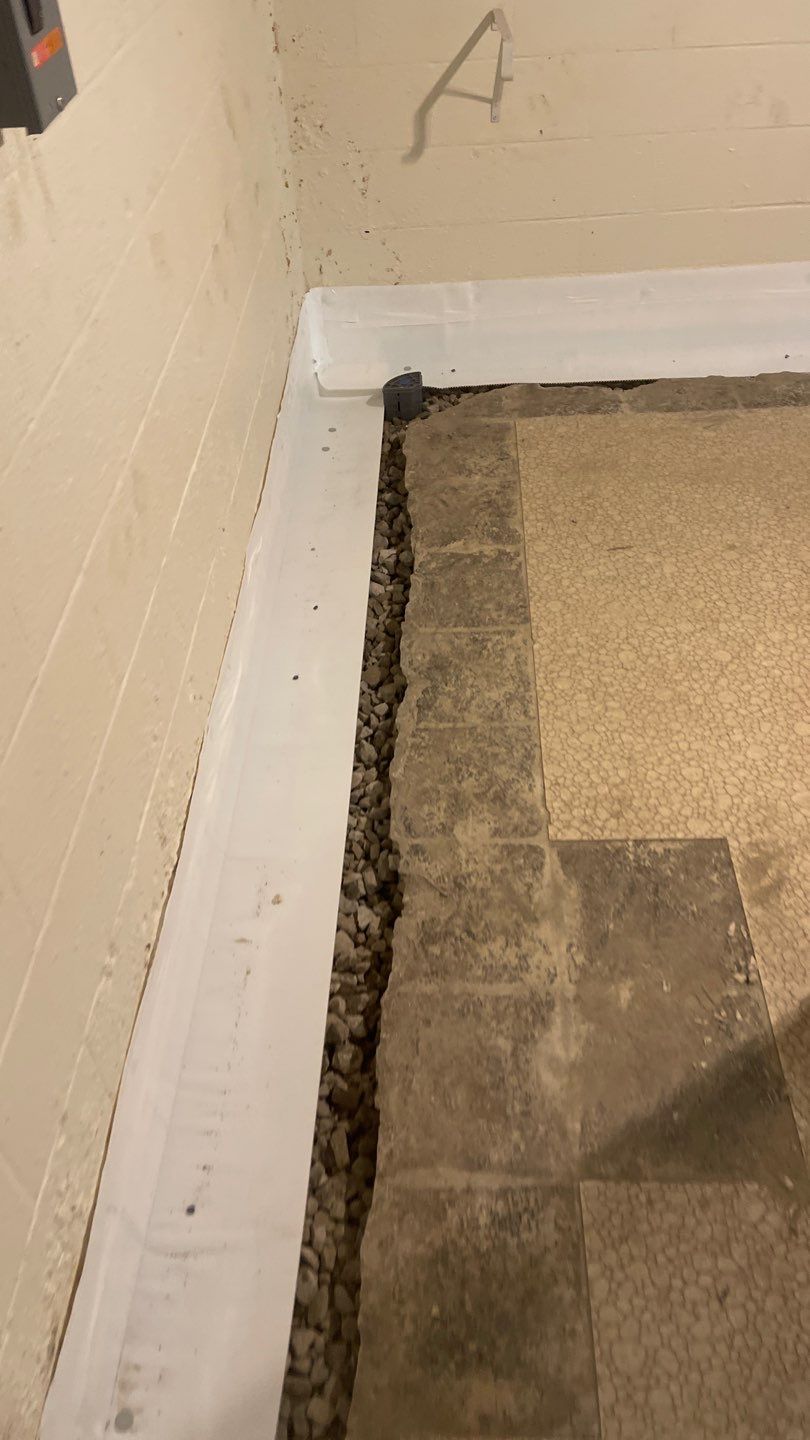 Interior Waterproofing Using GrateDrain™ Products by Toledo Basement Repair