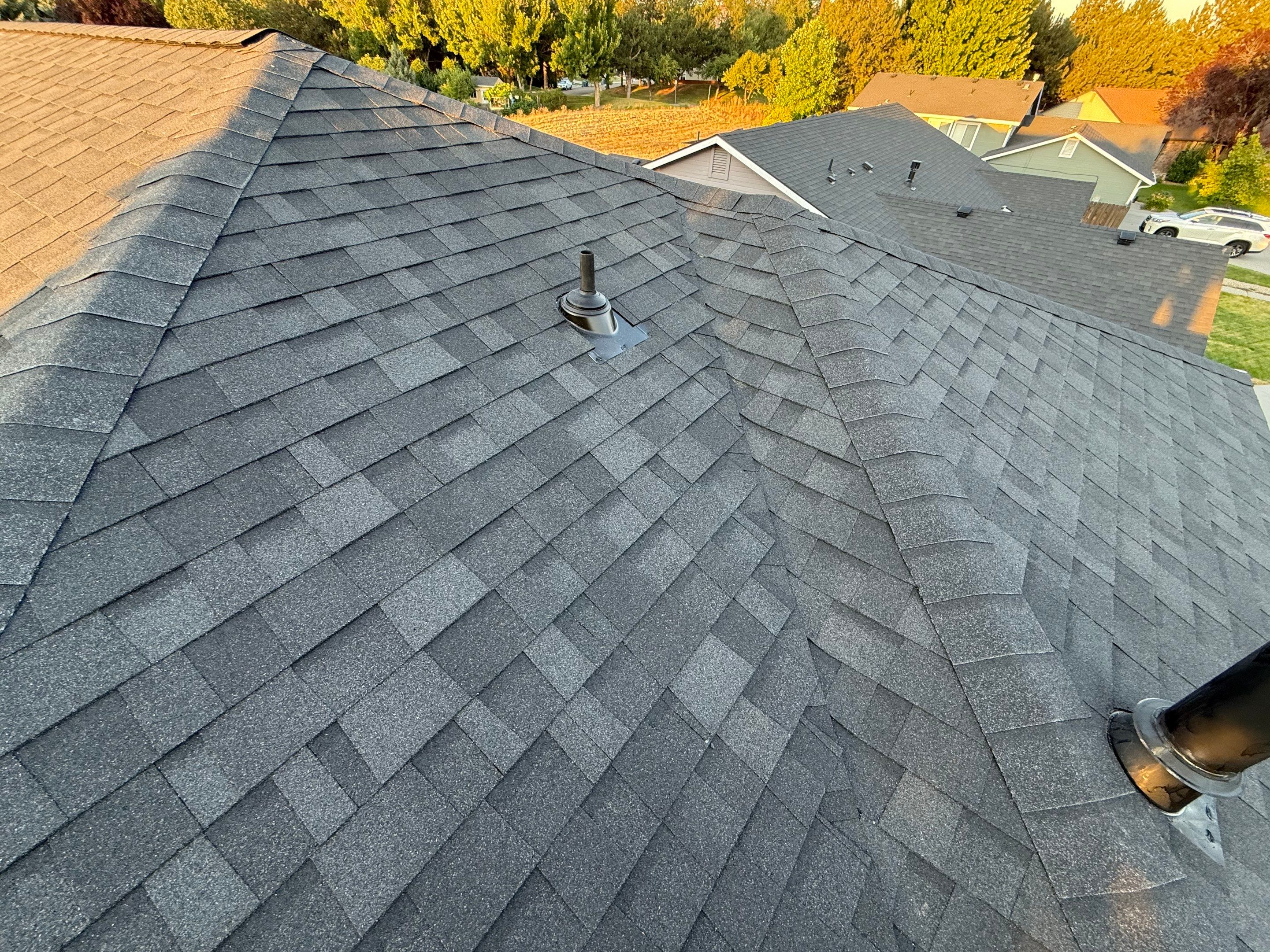Residential Roof Replacement and Seamless Gutter Installation in Boise by Olive Roofing