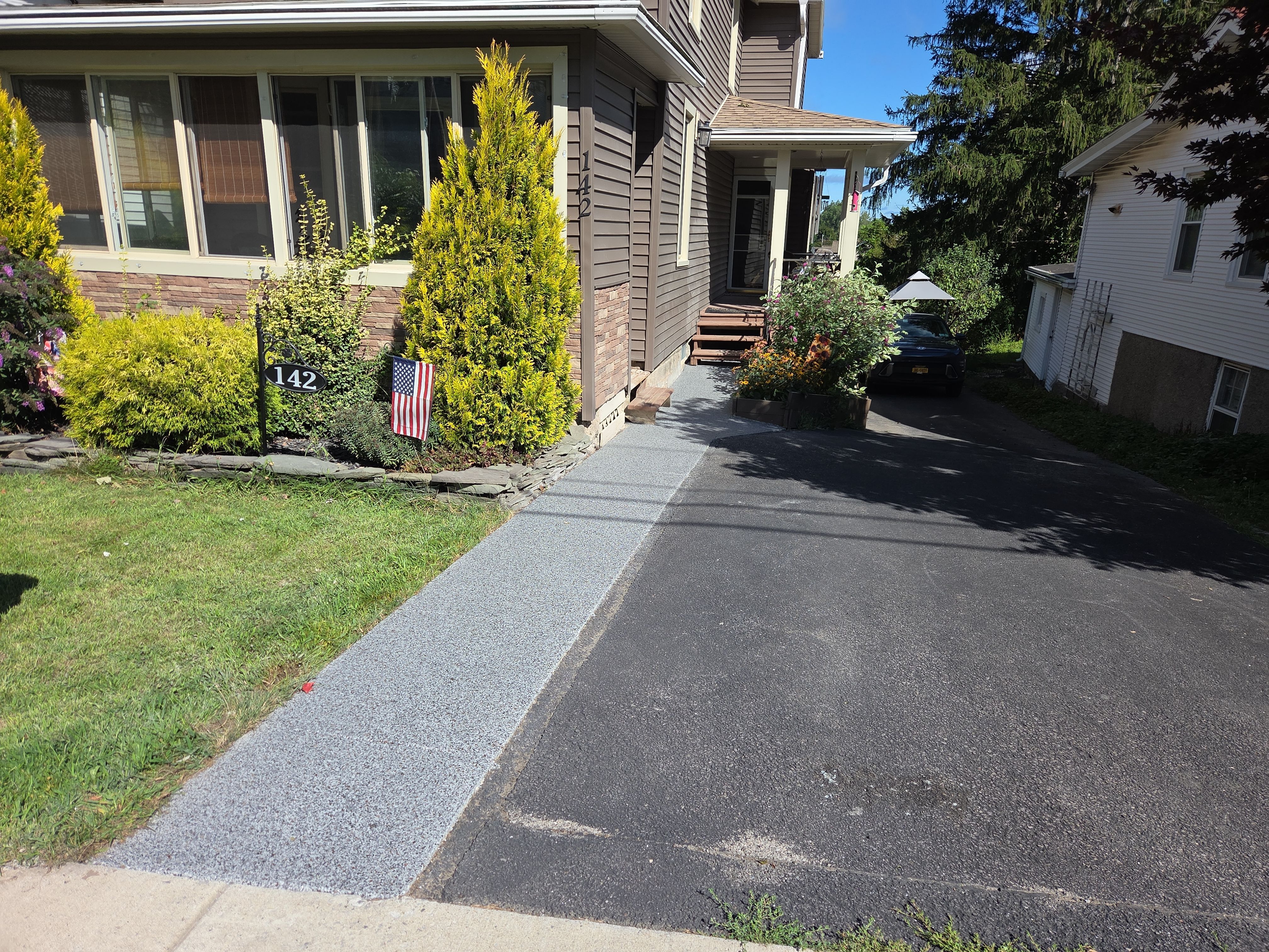 Earth Effects Stardust Sidewalk Coating by NG Masonry & Construction LLC