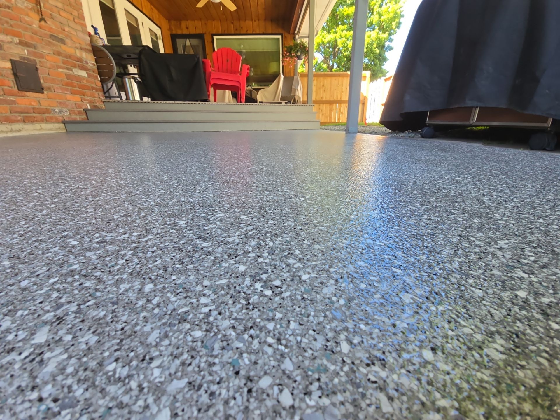 Patio Coating Transformation with Turquoise Hybrid Flake in Spokane by Croc Coatings, LLC