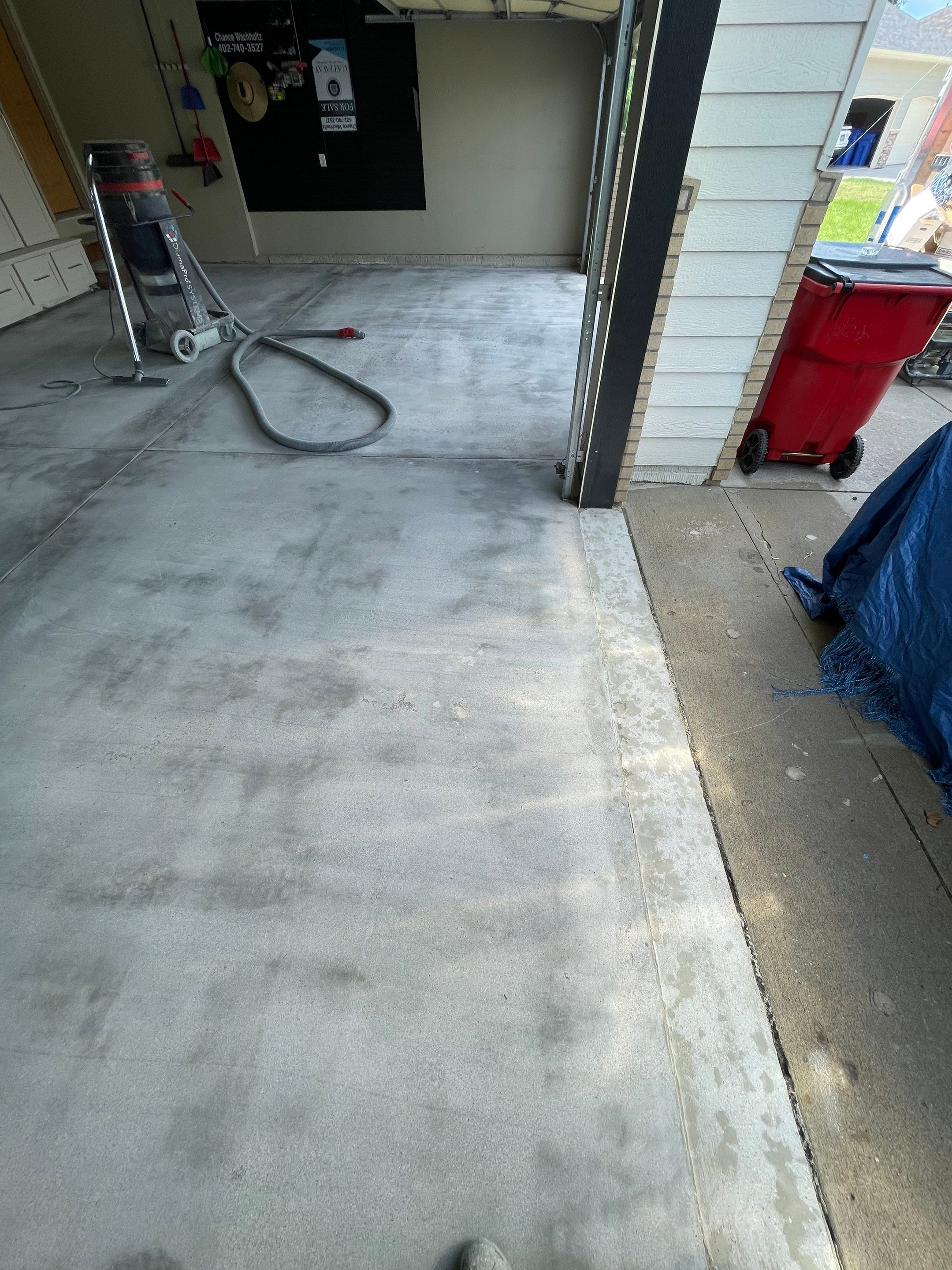 Cabin FEver Flake Garage Floor Coating Installation in Sioux Falls by Select Painting, Coatings & Garage Cabinets