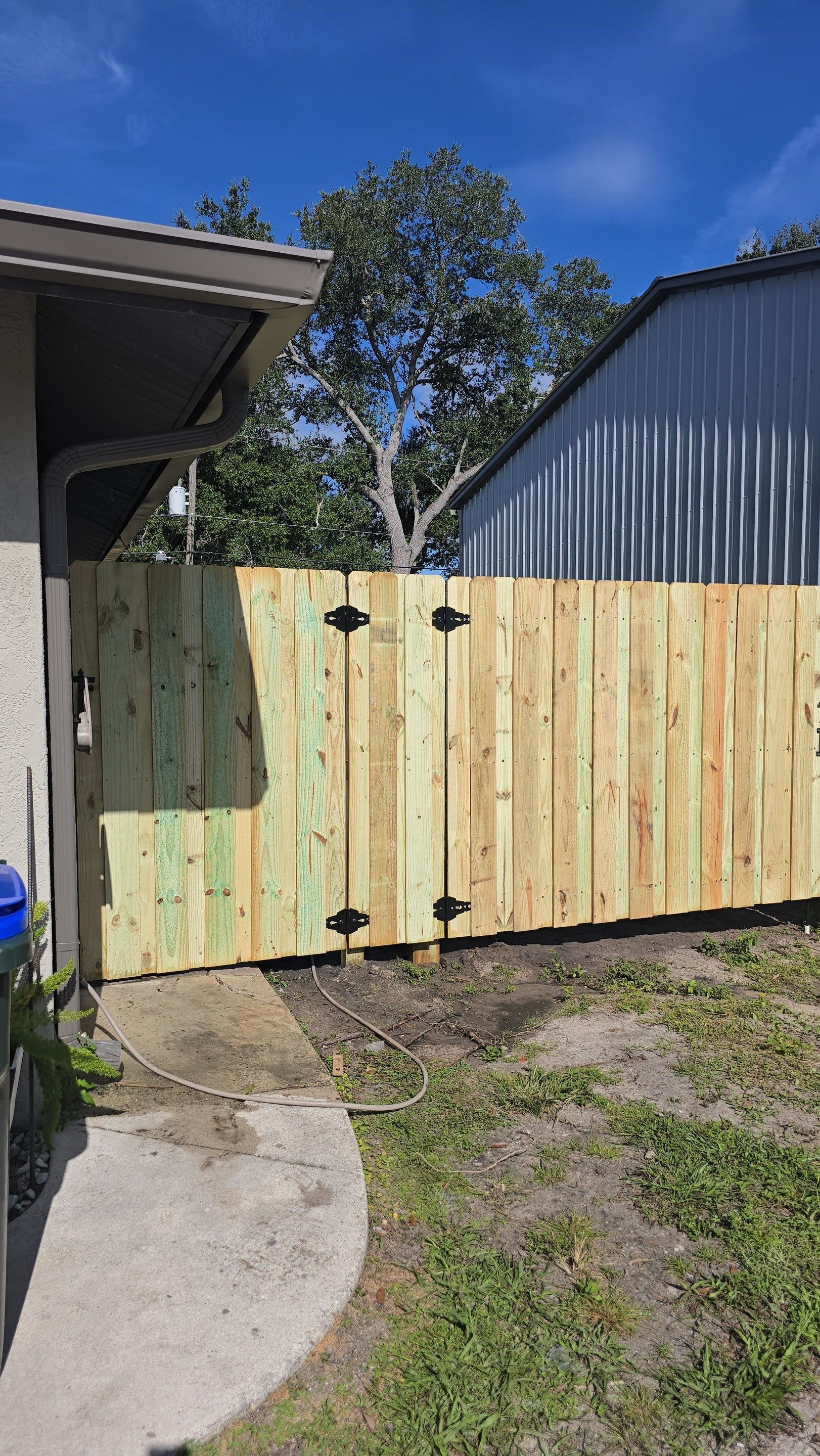 Pressure-Treated Wood Privacy Fence and Gate Installation in North Port by True Fence LLC