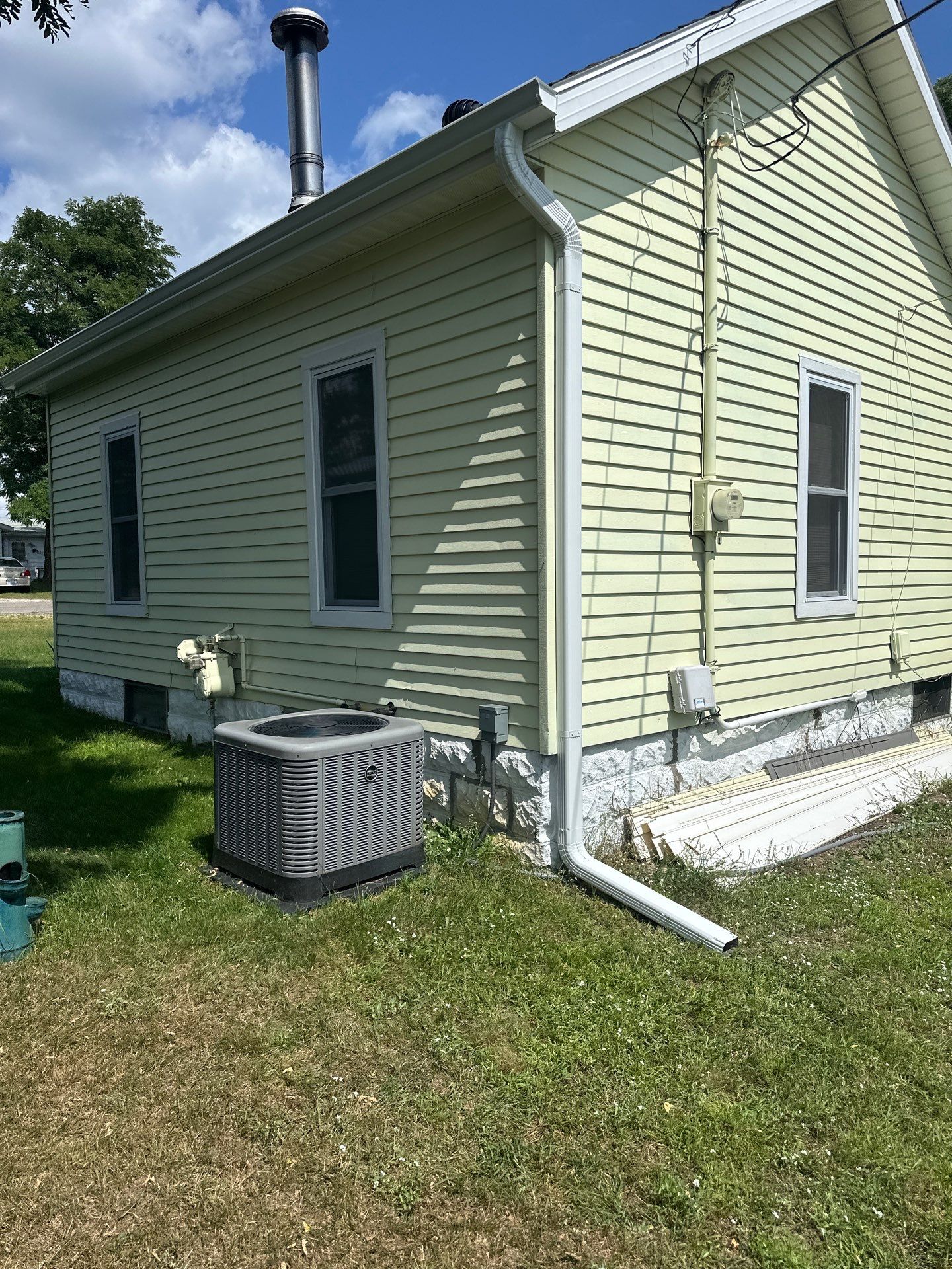 White Gutter and Downspout Installation for Lewiston Residence by Rainbow Seamless Systems