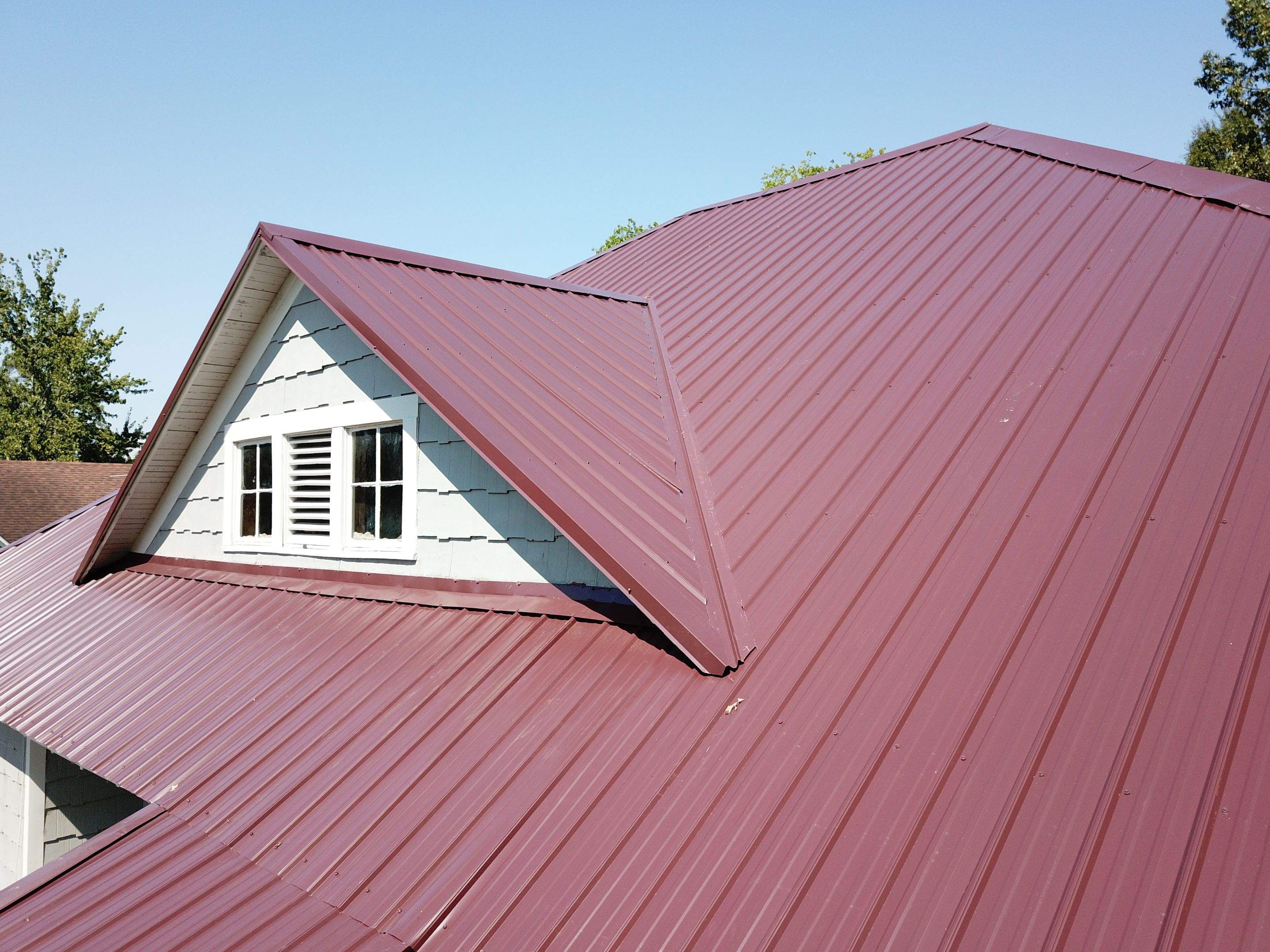 Residential Metal Roof Replacement using Reed's Metals: Colored Residental Panel (Burgundy) by Hostetler Roofing
