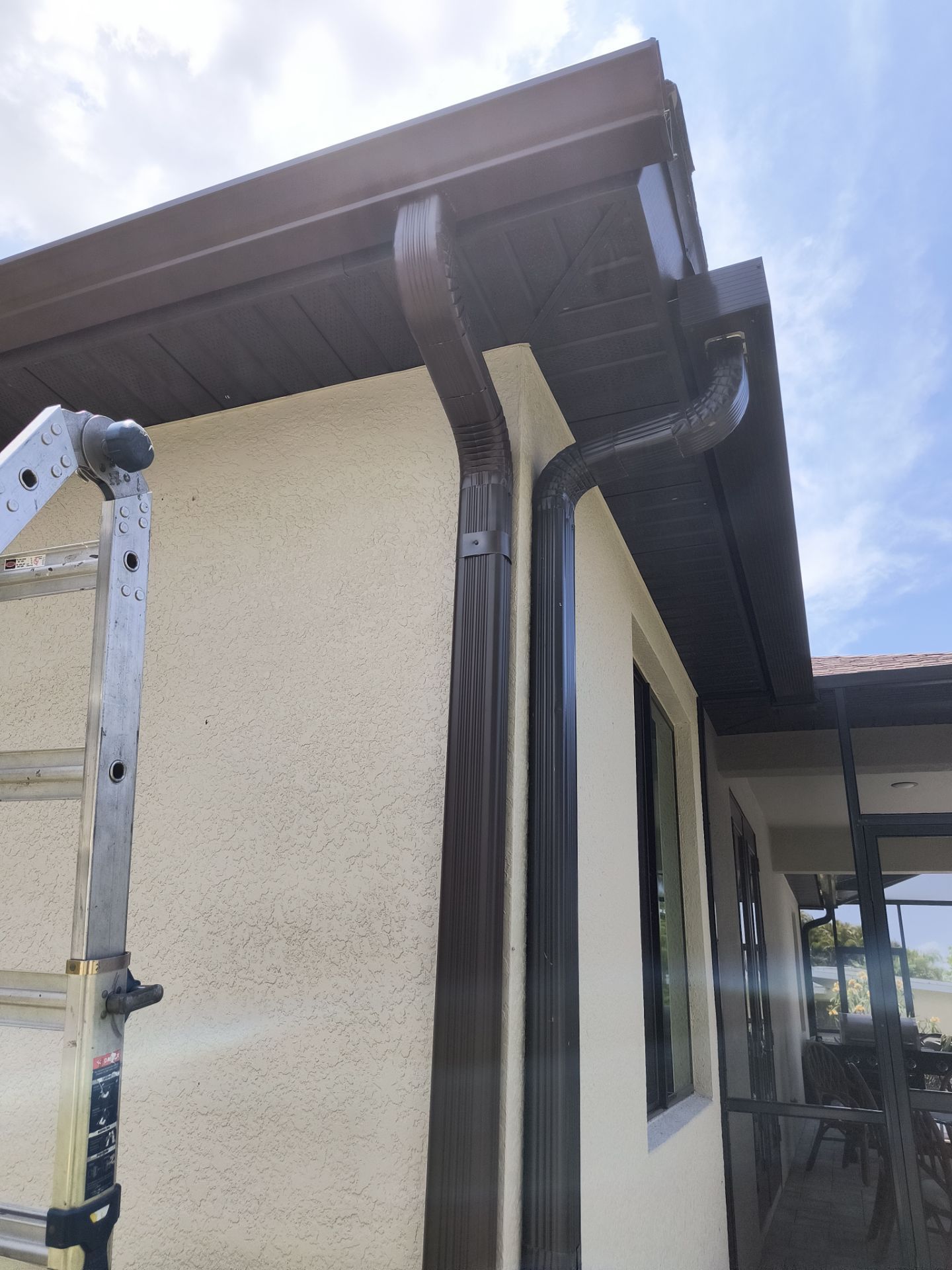 Custom Seamless Gutters and Downspouts for Large Homes in Tampa FL by Gutter Professor by Gutter Professors