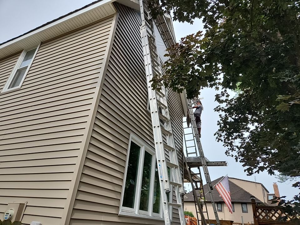 All New Craneboard D7 siding and New prefinished front door   by EEC  Windows, Siding & Roofing 