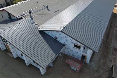 Metal roofing installation on church