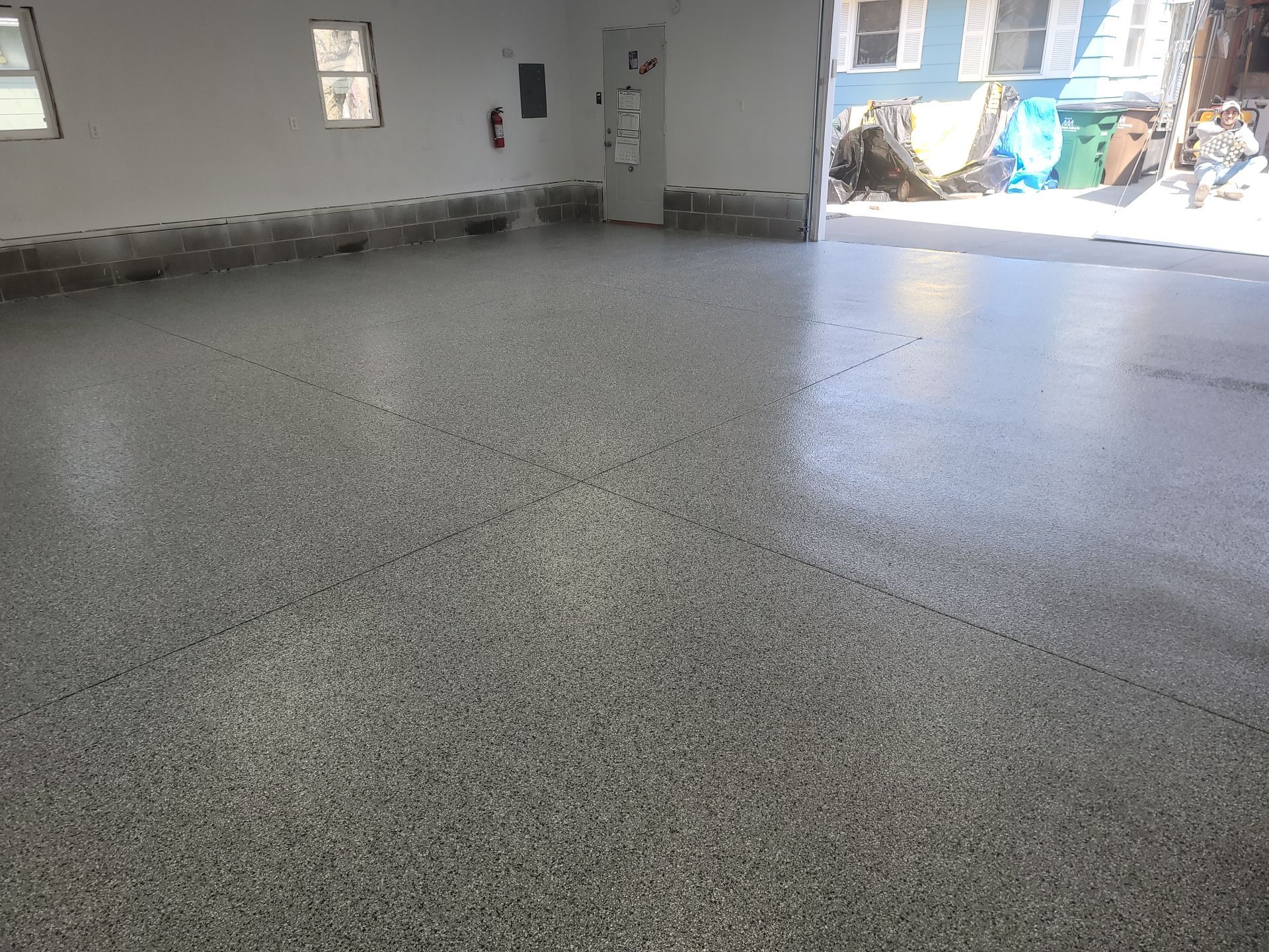 Flake Garage Floor Coating in Bondurant by Revival Concrete Coatings